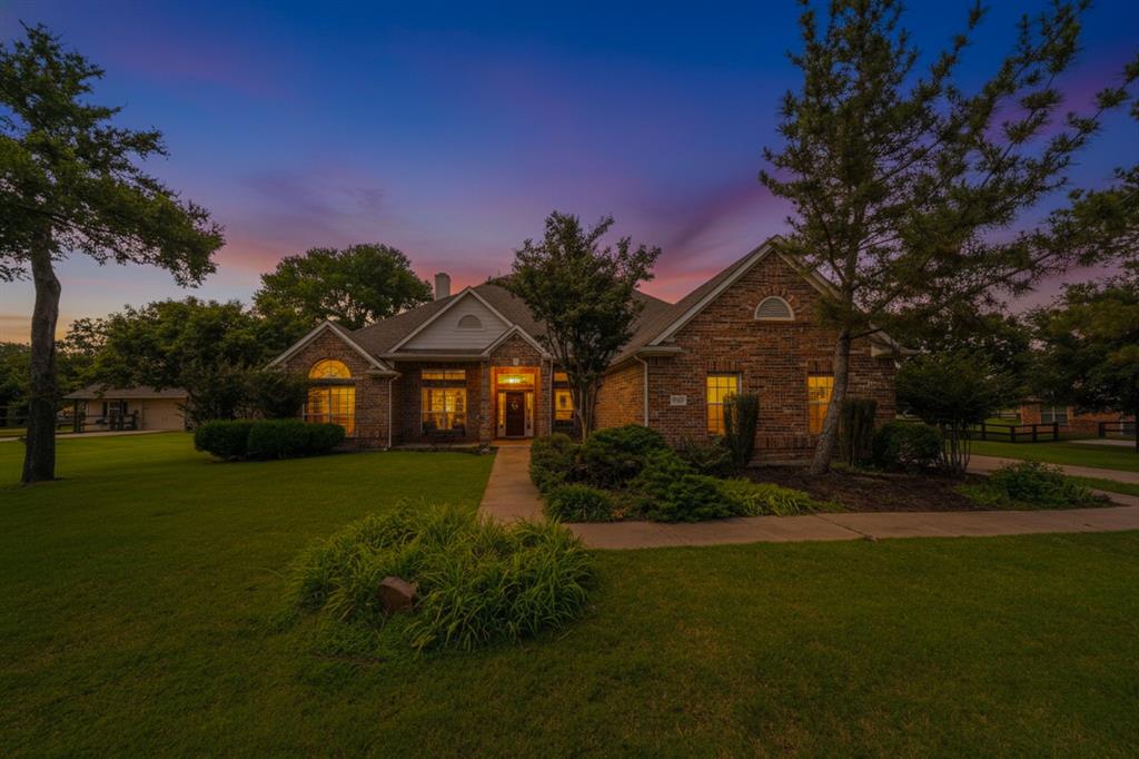 Enjoy estate living in the country! NEW carpet May 2026! This pristine home in the desirable Lakeview Ranch is ready for move-in! Walls of windows everywhere offer an abundance of natural light and appealing views of the outdoors. A lovely covered front porch both welcomes you and has room for you to sit and watch the world go by. The wide tile entry hall opens to elegant formal dining on the right and an office with built-in bookcases & French doors on the left. Straight ahead is the great room with fireplace, which is open to the sunny breakfast room and spacious kitchen - ideal for entertaining crowds or just relaxing. The kitchen features an island, loads of counter & cabinet space, gleaming granite counters, and large pantry. To the right of the breakfast room is a flex room - perfect for workouts or second office. All bedrooms are downstairs with a 3-way split bedrooms, giving this home multi-generational possibilities. Primary bedroom has a private exit to the back patio; primary bath has jetted tub, separate shower & vanities and large closet. Two secondary bedrooms share a hall bath; 4th bedroom is near the kitchen on the other side of the house and has its own bathroom. This home includes a large utility room; a mud room large enough to be used as a crafts room; and a large game room upstairs with built-in desks and a bathroom. An additional half-bath is in the hallway off the great room. The side-entry 3-car garage includes a pull-down attic stair with plenty of storage in the attic. A fenced area in back is available for your garden or small pets. HVAC unit replaced in early 2026.