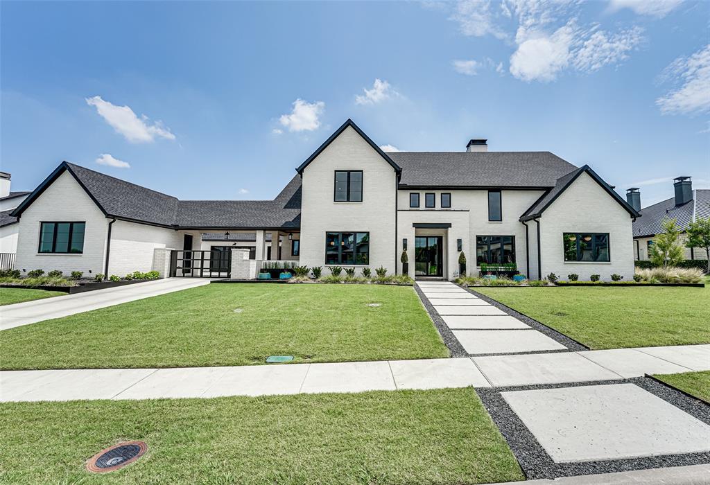 Exquisite home is perfect combo of elegance+comfort, combining modern architecture with top-of-the-line features making it the epitome of luxury living! Enter thru custom glass front doors to spacious interior with open-concept living area & large windows, allowing natural light to flood the area. White oak hardwood floors gives the home an elegant look. Kitchen is equipped with high-end appliances & fixtures: 6' fridge-freezer, 48 inch Ilve Italian dual fuel range+prep kitchen. Each bedroom offers an ensuite bath. Master suite boasts spacious closet, fireplace & spa-like bath with freestanding tub+separate shower. Private staircase leads to exercise room from master. Study, media room, 1st-floor custom guest suite has built-ins & staircase to private loft. Outdoor space is equally impressive:pool, inground trampoline, basketball court, 1200 sqft golf practice area+outdoor kitchen.Owners took great care in selecting high-quality materials to ensure home was both functional & beautiful.