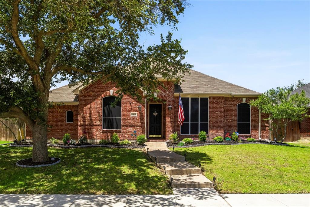 This beautifully maintained one-story brick home offers exceptional curb appeal with mature trees and lush landscaping that warmly welcome you home. Step inside to an inviting entry that opens to an expansive, versatile living space—perfect as a formal dining and living area or an oversized home office to suit your needs. The comfortable family room features a charming fireplace and seamlessly connects to the covered patio, creating the ideal setting for outdoor entertaining and relaxing evenings. The chef-inspired kitchen is designed to impress, boasting an abundance of cabinetry, a center island, built-in range, microwave, dishwasher, and a spacious pantry—all overlooking the dining area, making it perfect for everyday living and family gatherings. Retreat to the private primary suite, complete with a cozy sitting area and a spa-like ensuite bath featuring dual vanities, a soaking tub, separate shower, and a large walk-in closet. Three generously sized secondary bedrooms offer ample closet space and share a well-appointed full bath with dual vanities. Conveniently located near schools, shopping, dining, and major highways, this home combines comfort, functionality, and accessibility. This is the one that you have been waiting for!