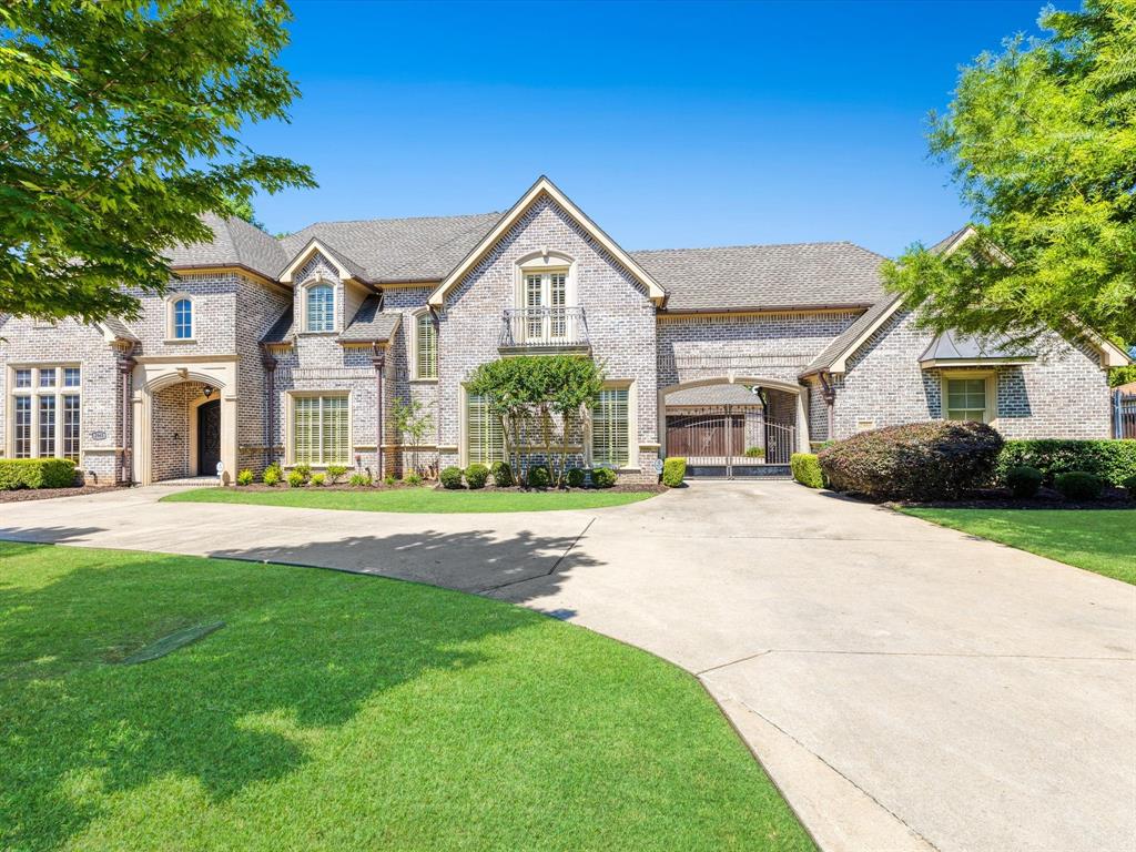 Architecturally exquisite and impeccably crafted, this custom estate is a rare gem tucked away on a serene cul-de-sac in prestigious Far North Dallas. Designed by Byron Smith Designs and masterfully built by H.G.R. Enterprises, this luxurious residence exudes timeless elegance, thoughtful functionality, and exceptional curb appeal. Set on a nearly one-acre premium lot, the home impresses from the start with its dramatic elevation, featuring stately rooflines and rich stone accents. Inside, a grand curved staircase and expansive foyer create a striking first impression, leading into an open-concept layout tailored for both lavish entertaining and intimate everyday living. Soaring ceilings, abundant natural light, and refined finishes define the main living spaces. The gourmet kitchen is a chef’s dream, equipped with a Wolf range, Sub-Zero refrigerator, two dishwashers, a massive island, walk-in pantry, and effortless flow into the breakfast and family rooms. The private primary suite is a true retreat, complete with a dedicated workout room, spa-like en-suite bath, and a custom walk-in closet. Spacious secondary bedrooms offer en-suite baths, providing comfort and privacy for family or guests. Additional highlights include a formal dining room with wine cellar, private study, two laundry rooms—one with a built-in pet wash station—and versatile first-floor flex spaces perfect for media, fitness, or play. A 3.1-car porte-cochère garage enhances both convenience and curb appeal. Outdoors, a covered living area with fireplace overlooks the backyard oasis, featuring a resort-style pool and lush, park-like landscaping. Thoughtful site placement ensures maximum natural light and privacy throughout the home. Ideally located near top-rated schools, upscale shopping, and fine dining, this one-of-a-kind estate presents a rare opportunity to own a custom-built masterpiece in one of Dallas’ most sought-after neighborhoods.
