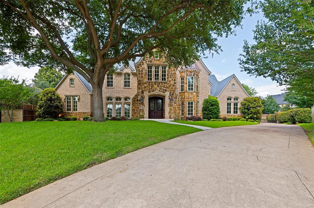 Welcome to your luxury back-of-the-cul-de-sac estate in the serene heart of Colleyville. Take a long walk in the park along the canal, secure within the guard-gated community of Montclair Parc where beauty, privacy and serenity reign. Arrive home to enjoy the rich finishes and designer materials inside and out that adorn the thoughtful layout of this home. Step into the two-story foyer which radiates grandeur with soaring ceilings and floor-to-ceiling windows bringing the backyard poolscape into the picture. Venetian plaster, a must-see, graces the office and formal dining area. Hardwood floors and hand-tooled walls flow throughout the lower level and to the upper floor. Your chef’s kitchen features bar seating and a separate great island for food prep and lots of kitchen storage. Enjoy friends and family from the kitchen or the walk-in wet bar or dining nook, all surrounding the spacious, vaulted central family room complete with full-length windows highlighting the expansive backyard, outdoor kitchen, pool and patio. Your primary suite features one of the home’s three fireplaces with a spa-inspired bathroom accessing separate, spacious walk-in closets large enough to serve as private dressing rooms. High ceiling and an en-suite bathroom feature in the spacious downstairs guest room. A full pool bath offers resort amenities to your backyard guests. A butler’s pantry, desk room, utility room and under-stair closets provide great storage and convenience options. Upstairs, cut loose in the enormous gameroom, complete with a large, shelved bonus room and Juliet balcony. Screen a movie or watch the big game in your dedicated media room complete with wet bar and half bath. A scenic upstairs bedroom with large walk-in closet overlooks the pool and backyard, while two more bedrooms with full en-suite baths and walk-in closets will delight family and friends. Lush backyard. New metal roof 2025. Close to everything!