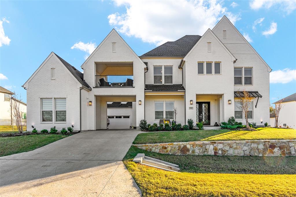 [[MOTIVATED SELLER SUBMIT OFFER NOW!!]] Nestled in the prestigious Town Lake neighborhood of Flower Mound, this stunning Toll Brothers home offers the perfect blend of elegance, modern comfort, and thoughtful design. The meticulously landscaped grounds and heavy-duty double wrought iron doors welcome you into a space defined by sophistication. Inside, a grand curved staircase sets the tone, complemented by French Oak hardwood floors, high ceilings, and intricate wall paneling. The kitchen is a chef's dream, featuring quartz countertops, a commercial-grade cooktop and vent, built-in KitchenAid appliances, a double oven, a spacious island, a walk-in pantry, and a cozy eat-in area perfect for gatherings. The master suite serves as a luxurious retreat with a spa-like bathroom, while modern light fixtures throughout the home enhance its contemporary appeal. This expansive 5,000+ sq. ft. residence boasts 5 bedrooms, each with an ensuite bathroom, a formal dining room, private study, game room, and media room. Sliding doors lead to Elite cabana-covered patios and a balcony, where you can relax and enjoy the cool breeze with family and friends. Outside, the spacious backyard offers ample room for outdoor activities, while the three-car garage and private parking spaces complete this exceptional property. A true gem in one of Flower Mound's most sought-after neighborhoods, this home delivers luxury, style, and comfort at every turn. This is not just buying a home its buying a Lifestyle.