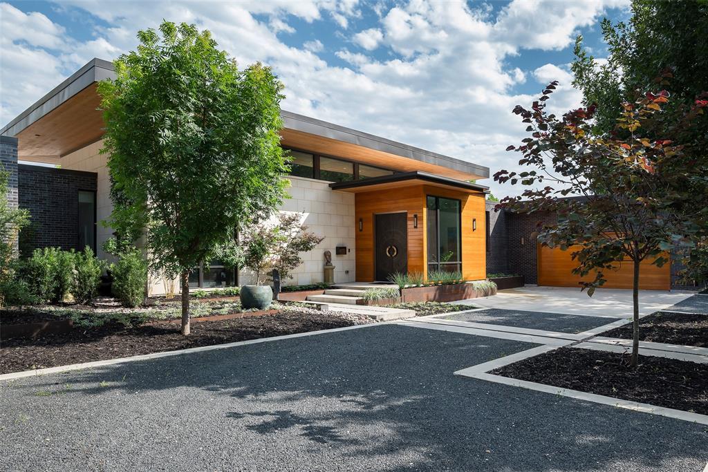 Nestled on a quiet street in Midway Hollow’s southern section, this custom-built modern home offers 4,150 sq ft of single level luxury on a .49 acre lot. Designed for both comfort and sophistication, it features three bedrooms, three and a half baths, and two versatile flex rooms. Ideal for an office, gym, or meditation space. An inviting bronze blade cut entry door opens to a living and dining area with soaring 15 foot ceilings beneath a cantilevered roof, where strategically placed windows bathe the space in natural light. Kitchen highlights include a labradorite slab island, solid hardwood cabinetry, and a pantry prep area. Designed for seamless indoor-outdoor living, the main living room extends to a spacious patio with multiple lounge areas, a fireplace, a grilling station, and a temperature controlled pool and spa. All surrounded by lush, private landscaping. The primary wing is a true retreat, featuring a meditation room overlooking a crystal garden. Relax in elegance amongst the fireplace, and a spa like bath adorned with Ann Sacks tile and Maestro fixtures in the primary bedroom. The guest wing includes two rooms with a shared bath, a powder room with Macassar Ebony cabinets and Nicolette Mayer wallpaper, and a flexible home gym or office space. Luxury finishes include four inch Red Oak flooring, Level 5 drywall, Crestron integrated lighting, and shade systems. Peace of mind is offered with a whole home generator, three HVAC systems, and two tankless water heaters with a reserve tank. A sanctuary of tranquility, privacy, and modern refinement, this home is truly an exceptional living experience.