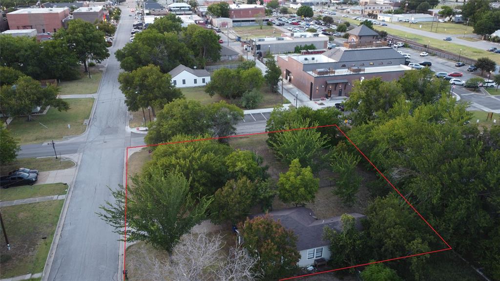 Perfect Location in Old Town Burleson! This is Your Property!! CORNER 2 Lots including a House!
These two properties are at the corner of W Eldred & S Wilson with over 125 feet on each road. Located just a stone's
throw from Station 330 and only a block from Razzoo's, The Porch, and Lumberyard Bar and Grill you'll be perfectly
located in the mix of entertainment, restaurants, and community events. The home is currently zoned residential,
giving you the opportunity to be at home and have a salon, office, boutique, etc too. The opportunities are endless!!
The home is Original to Burleson with Hardwood Floors, New Kitchen Cabinets, Countertops, & Sink. Most of the Rooms
have two entries making it ideal to convert to commercial! Bring Your Ideas & Let's Make a Deal!!