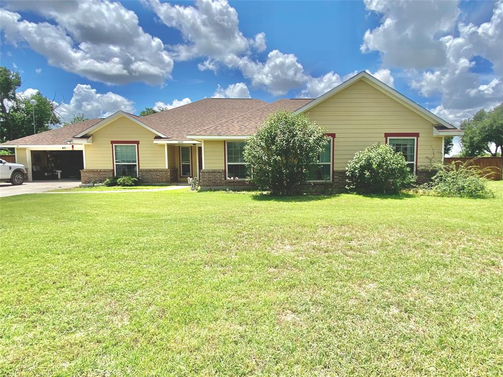 Welcome to 1005 Terrace St in Bangs, Texas — a thoughtfully designed residence offering comfort, efficiency, and room to grow on a generous 0.5-acre homesite. This well-appointed 4-bed, 3-bath property provides an effortless opportunity to create a true 5th bedroom, making it an exceptional fit for buyers seeking flexibility and space.

The home opens to inviting vaulted ceilings and a warm, spacious living area anchored by a classic fireplace — a perfect focal point for gatherings or quiet evenings at home. Natural light enhances the open layout, creating a comfortable flow throughout the main living spaces and highlighting the home’s thoughtful design.

The kitchen is a standout, featuring granite countertops, a generous kitchen island, double oven, and included refrigerator, offering both functionality and style for everyday cooking or entertaining. The primary suite provides a relaxing retreat with a soaking tub, separate walk-in shower, and a spacious walk-in closet. Secondary bedrooms are well-sized, and the additional flex space easily converts into a fifth bedroom, office, or guest suite.

This property is equipped with solar panels for long-term energy savings, a 2-car garage, and upgraded PEX water lines with individual cut-off valves, providing modern reliability and peace of mind. The expansive half-acre lot offers ample room for outdoor living, gardening, or future enhancements, giving buyers the freedom to create the outdoor environment they envision.

Situated in a quiet Bangs neighborhood, this home delivers a rare combination of space, efficiency, and versatility — a well-maintained property that reflects pride of ownership and offers exceptional value in today’s market.