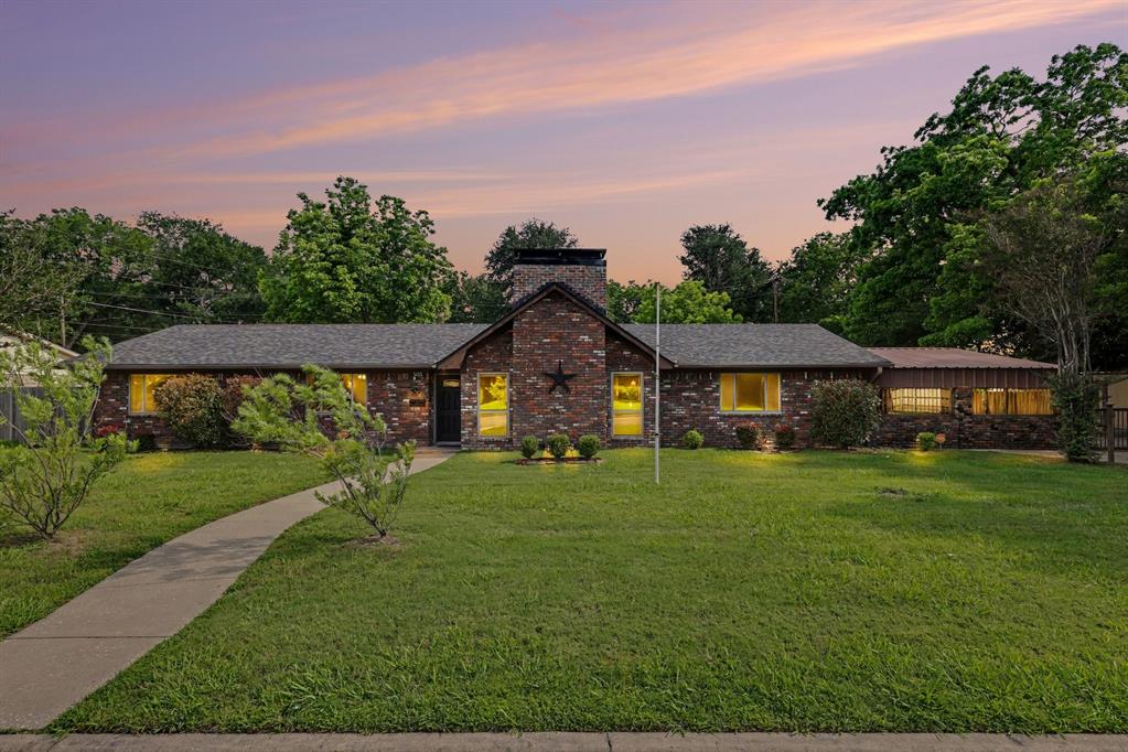 Fall in love with the character, charm, and incredible outdoor space this inviting single-story home has to offer. Nestled on an expansive, park-like lot of nearly one acre, this property provides the perfect blend of privacy, mature shade trees, and endless possibilities for outdoor living. Whether you're dreaming of a resort-style pool, sports court, garden, or custom outdoor entertaining area, there's plenty of room to bring your vision to life. A massive Texas-sized front porch creates a warm welcome and the perfect spot to relax and enjoy your morning coffee. Inside, rich hardwood floors, beamed ceilings, and a stunning floor-to-ceiling brick fireplace create a cozy yet stylish atmosphere. The spacious living room flows seamlessly into the dining area, highlighted by a striking brick accent wall that adds warmth and character. The beautifully updated galley kitchen features stainless steel appliances, quartz countertops, designer backsplash, and crisp white cabinetry, offering both functionality and timeless appeal. Just off the dining area, a convenient wet bar makes entertaining family and friends effortless. The home offers three comfortable bedrooms and two full baths, along with a generously sized game room that provides flexible space for recreation, a media room, home office, or playroom. The secondary bedrooms are spacious and well-appointed. Step outside to enjoy the covered patio, which can also serve as additional covered parking. A carport, storage building and sprawling backyard further enhance the property's versatility and appeal. Located in an established neighborhood near the golf course and just minutes from shopping, dining, and everyday conveniences, this rare property offers the space and lifestyle you've been searching for without sacrificing the convenience of city living. Don't miss this unique opportunity to own a charming home with room to grow, play, and create your own backyard paradise.