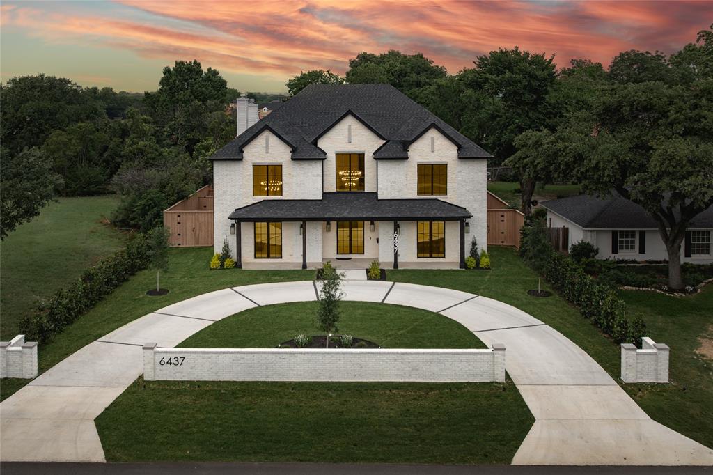 Crafted by the renowned Strange and Sons Development, this architectural masterpiece is a stunning display of luxury, scale, and sophistication. This 6,075 square foot new construction residence offers five spacious bedrooms, five and a half designer bathrooms, a flexible downstairs bonus room, private study, and an expansive upstairs game room, seamlessly blending function and elegance. Soaring 20+ foot ceilings welcome you into a light-filled open concept layout, anchored by wide-plank white oak flooring and curated finishes throughout. The heart of the home is a show-stopping kitchen featuring a twelve-foot island with built-in storage, white oak and alabaster cabinetry, luxury stone countertops, and designer brass fixtures, a true chef’s and entertainer’s dream. Just behind the main kitchen, a fully outfitted scullery kitchen adds both convenience and elegance, complete with an additional full-sized refrigerator and dishwasher, perfect for entertaining or everyday prep and cleanup. Adjacent, a custom wet bar and wine bar offer the perfect setup for sophisticated hosting. The living space opens beautifully to the backyard through a dramatic four-panel sliding glass door, creating a seamless transition between indoor and outdoor living. The luxurious primary suite is a private retreat with a spa-inspired bathroom boasting a massive walk-in shower, Carrara marble finishes, and elegant brass hardware. Each secondary bedroom is generously sized and includes its own en-suite bath and custom closet space. Step outside to your own private oasis, where a covered patio with a built-in outdoor kitchen overlooks a sleek, modern pool. Additional highlights include an oversized two-car garage, designer lighting and high-end hardware throughout, an upstairs balcony retreat, meticulously selected tile and stonework, and energy-efficient systems with smart home capabilities.
