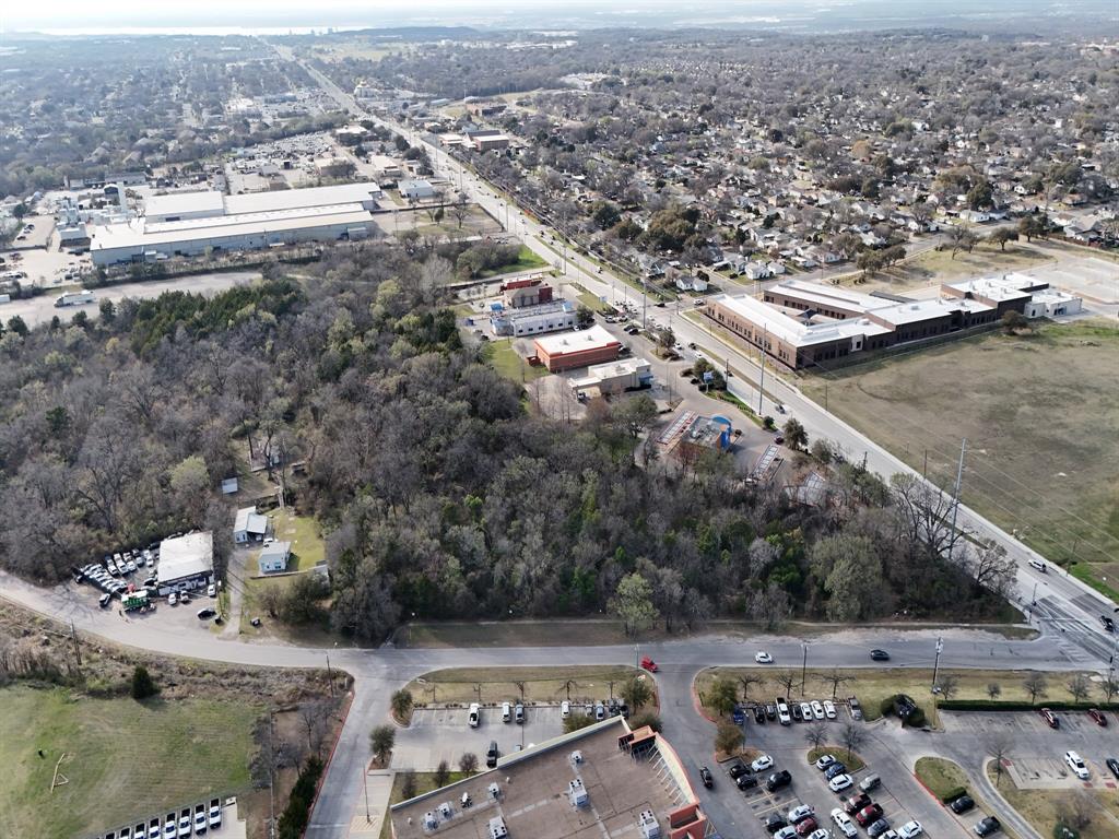 Approximately 5-acre wooded tract located at 3720 W Illinois Ave in Dallas. The property is subject to a conservation easement held by the City of Dallas which restricts construction on the land. While not independently buildable, the tract may present an opportunity for a developer familiar with conservation easements to evaluate potential use as open space within a larger assemblage or future development concept. Located within the Dallas city limits with convenient access to Loop 12 and nearby commercial corridors. Buyer to verify all zoning, easement restrictions, floodplain conditions, and development possibilities with the City of Dallas.