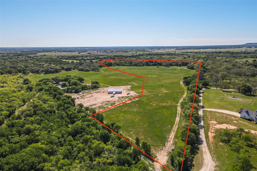 This 32.95-acre flagship tract is the premier offering of the plat, balancing massive scale with immediate, turn-key utility. The heavy lifting is already finished: a brand-new well is in place, power is on-site, and a premium homesite has been professionally cleared on high ground well outside the flood zone. Defined by significant frontage along Stroud Creek and a dense canopy of mature pecan and hardwood trees, the acreage offers a private recreational sanctuary right in your backyard. Most importantly, all mineral rights convey with the sale, securing the long-term value of the land as a serious financial asset. Whether you are looking to build a private family legacy or land-bank a significant holding near town, this 32.95-acre parcel is the standout choice.