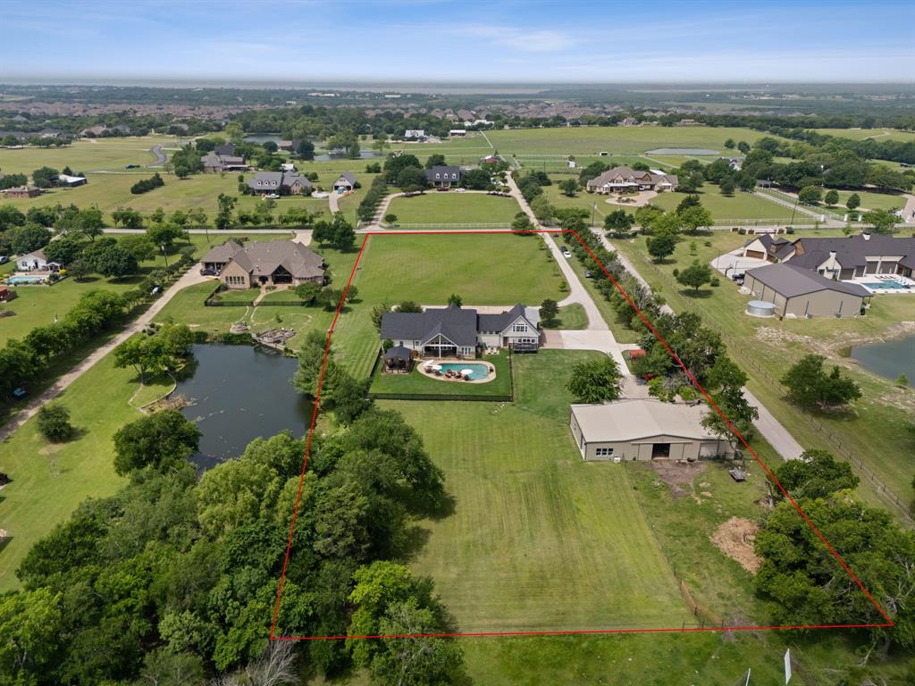 Nearly 4 acres in North Rockwall. You know how rare that is.
The views are what set this property apart. Open land, unobstructed, the kind of setting that is disappearing fast in DFW.
The main home is 4,436 sq ft. 5 bedrooms, 4 full baths, a half bath. Pool, large covered outdoor entertaining space, covered porches front and back. Every bit of that outdoor setup faces those views. There is plenty of parking for weddings or events at your home. 
The barn is 3,200 sq ft total with three horse stalls, an 800 sq ft of shop space, and a fully finished 800 sq ft apartment inside.That is your 6th bedroom and 5th full bath There is . Works for guests, extended family, or rental income.
An additional 7 acres adjoining the rear is also available if you are looking for more space. Additional land not sold alone. Room for horses, cattle, or simply land that stays yours.
Sellers are open to owner financing.
Genuine gem in North Rockwall.