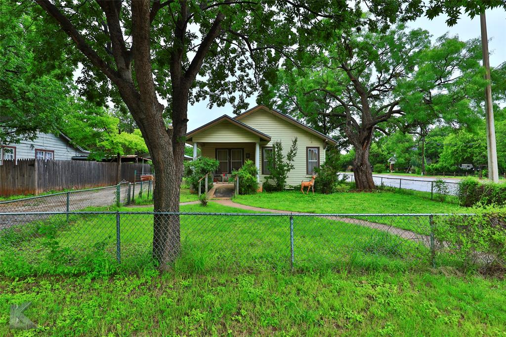 3 bedroom, 1 bath home in a quiet neighborhood. This house has the potential for endless possibilities. Step inside to find an open concept living room kitchen with an eat-in dining area that makes entertaining a breeze. The enclosed sunroom could provide additional natural light and would be perfect for relaxing after a long day. Enjoy the private, fenced backyard that offers plenty of outdoor living space on the corner lot. This property is sold as-is so you can have the freedom to make it your own! Start transforming this home into your ideal family space today!