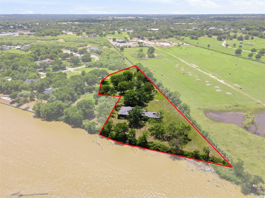 Welcome to your 221sf of WATERFRONT living totaling 1.77 acres with AMAZING views and sunsets....Whether you are looking for FUN or relaxation this can be for you....complete with your own WELL........NO HOA........NO city TAXES...........All of this is waiting for you to build your DREAM HOME........Feel like you are in your own private PARADISE but yet only 8 minutes from Granbury's Historic Town Square where you can shop at boutiques and antique shops, eat at amazing restaurants, listen to live music, see a show at theatre, enjoy night life, events, spas, and much more!!! Yes, you can have a boat dock built too!!! Did I mention you can dine out and shop via boat............WHAT are you waiting for??? Bring your boat, jet skiis, kayaks and more and learn to live and enjoy LAKE life!!!!!No value placed on the house, call for more info. MLS 21298024, 3212 Sunrise Ct, next door also for sale featuring 18.4 Ag EXEMPT acres