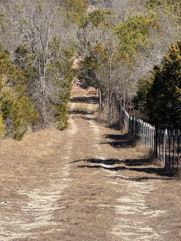If you are looking for serenity, this is it...16 acres with a little terrain. There is a great building spot about 20-30 feet elevation above the pond. The pond looks like it could use a little work to maintain water. It has a seasonal creek that feeds into it. All properties surrounding are very well kept. This diamond in the rough needs a little clean up. I would say once it is cleaned up, the value would be north of $400k. There is an electric meter on the property. I cannot verify that there is a septic system on the property, however I would be shocked if there is not. There is a water line to the property. We cannot verify where it goes on the property. This property has not been occupied in 9 years. There are two mobile homes, 4 boats and lots of trash that needs to be hauled off. I would say about $30-40k in haul off fees if you paid someone else to do it. But do not take my word, do your own due diligence. This property is not on the main road, it is at the end of an easement. This makes it more secluded and I did not hear any road noise the few times I have been out here. Buyer will need to buy their own survey.