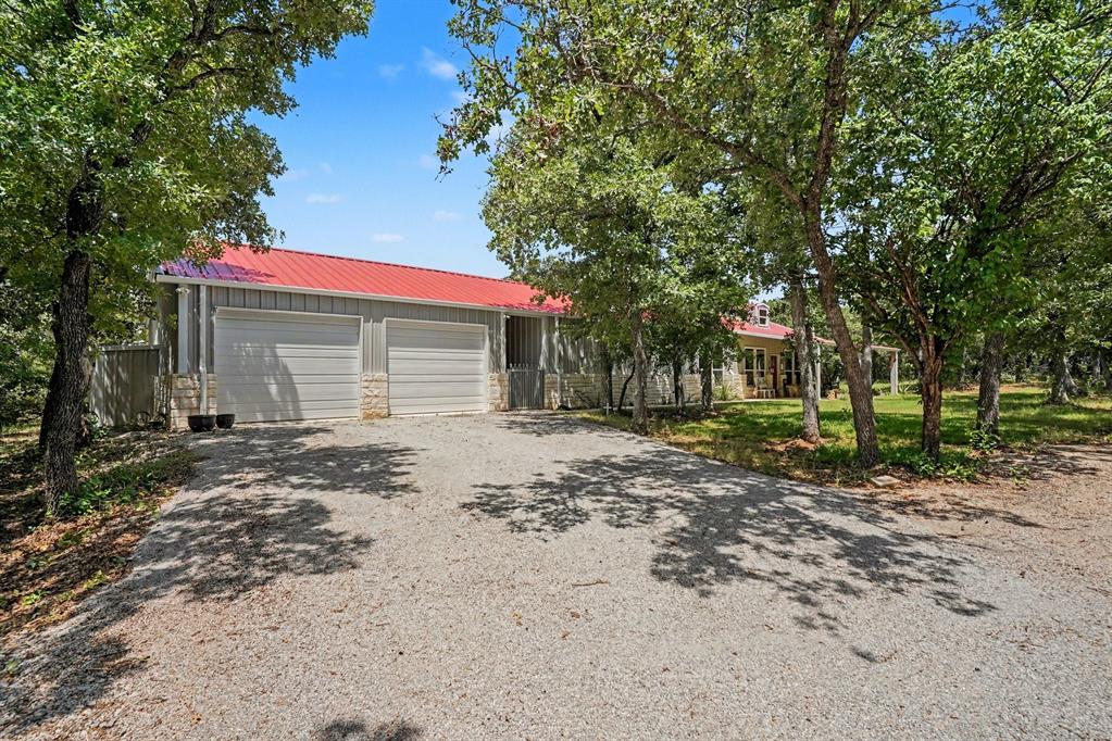 Welcome to peaceful country living in the desirable Ranches at Rolling Hills community. Situated on a spacious acreage homesite, this well-maintained 2-bedroom, 2.5-bath home offers the perfect combination of comfort, functionality, and privacy.

Designed with versatility in mind, the home features a dedicated office that can serve as a workspace, hobby room, or potential guest area. A standout feature is the built-in safe room, providing added security and peace of mind.

The open-concept living and dining areas create a warm and inviting atmosphere, while the kitchen offers ample cabinet and counter space for everyday living and entertaining. The primary suite provides a relaxing retreat, and the secondary bedroom offers comfortable accommodations for family or guests.

Enjoy outdoor living year-round with both a covered front patio and a covered back patio, offering the perfect spaces to relax, entertain, and take in the peaceful countryside surroundings.

The oversized 2-car garage includes additional storage space, making it easy to keep tools, equipment, and recreational gear organized. Outside, you'll find plenty of room to roam and enjoy the beauty and privacy of country living.

Residents of Ranches at Rolling Hills enjoy access to community amenities, including stocked fishing ponds, a community park, and proximity to the LBJ National Grasslands. If you're looking for a home that offers privacy, practicality, and a peaceful setting, this property is a must-see.