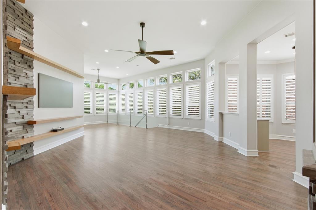 Premium location offers amazing view everyday overlooking the 18th fairway on The Hills of Prestonwood golf community! _Enjoy fabulous golf views from spacious main living, dining, primary bedroom, downstair bedroom & game in this TOTALLY UPDATED home! You'll notice gorgeous white oak wood floors & oversize 2x4 Italian porcelain stone tile the moment you enter! Professionally redesigned kitchen updates include KitchenAid 6 burner 36 inch duel fuel gas range oven, modern Brisas glass exhaust hood over island, built in 2nd oven, convection steam cook microwave & refrigerated drawers for beverage convenience! You'll see unique designer touches thru-out in addition to quality solid 8 ft tall doors, elegant architectural style with 12 ft ceilings, LED designer lights, updated fans 6 inch baseboards, brushed nickel Schlage hardware & 5 inch wide shutters! Primary suite has 2 closets & is completely renovated with new cabinets, quartz counters, dressing counter, built in towel warmers, soaking tub & designer tile glass shower! Impressive modern glass panels lead down wood stairs to 2nd living & most amazing spacious 4th living plus 11x25 work room! Walk out to most peaceful view with optional 8x22 retractable awning over 43x10+ Belgard paver patio! Enjoy the recently installed semi-recessed hot tub landscaped for low maintenance with artificial turf! Freshly installed hurricane rated hi energy efficient vinyl windows continue to bring in the lush landscape! Redesigned utility with stackable washer-dryer, new cabinets & sink! Whole house Kinetico water softener installed 2025! Epoxy floors in garage! Enjoy dining just steps away at The Hills of Prestonwood clubhouse with tranquil views overlooking the lake! Social memberships including pool, start at $220 a month. The Hills at Prestonwood community is known for great walking, Indian Creek Park with playground & is adjacent to Arbor Hills Nature Preserve! Close to North Dallas Tollway!