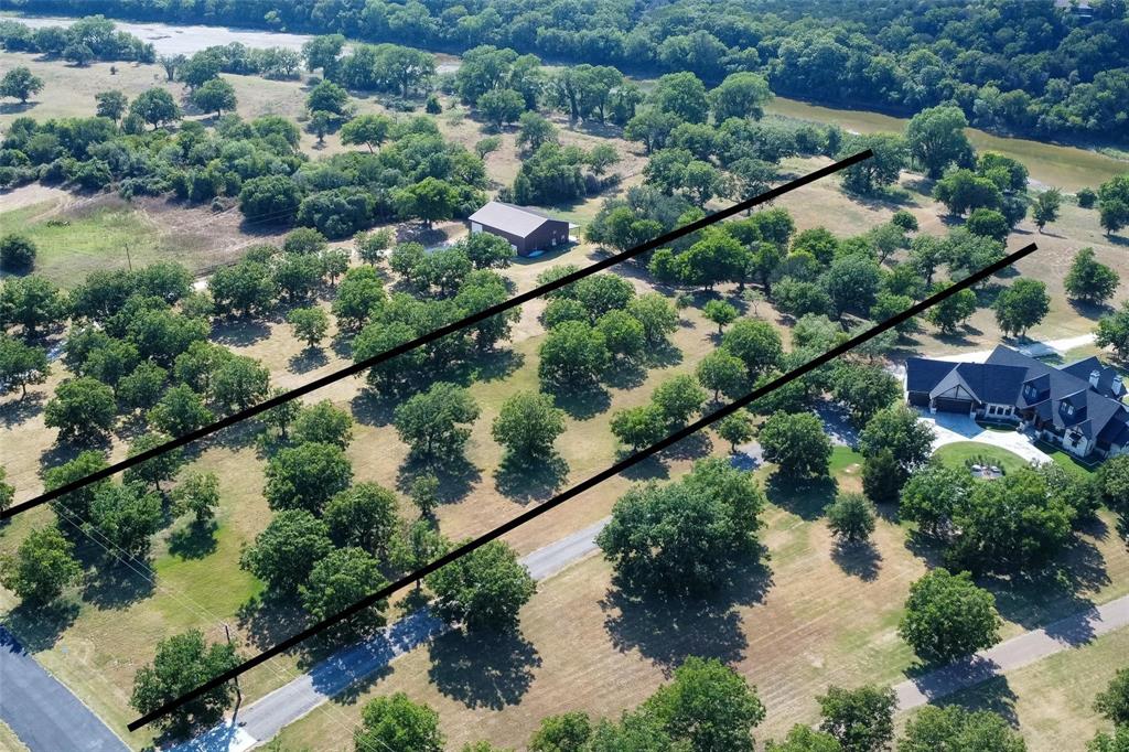 Build your dream riverfront retreat in The Orchards on the Brazos! This stunning 3+ acre homesite is tucked away at the end of a quiet street, offering exceptional privacy and a peaceful, secluded setting. Enjoy breathtaking views of the Brazos River from along the street, with direct river access right on your property making it perfect for relaxing, fishing, or simply taking in the natural beauty. The land is adorned with mature pecan trees, creating a picturesque backdrop for your future home. While the property feels like a private escape, it’s conveniently located just minutes from Glen Rose, Hwy 67, and a short drive to the Chisholm Trail Parkway for easy commuting. Situated within the highly regarded Glen Rose ISD, this location combines the charm of small-town living with access to local dining, shopping, and historic attractions. Whether you’re looking to build a full-time residence or a weekend getaway, this property offers the ideal blend of tranquility, convenience, and scenic beauty.