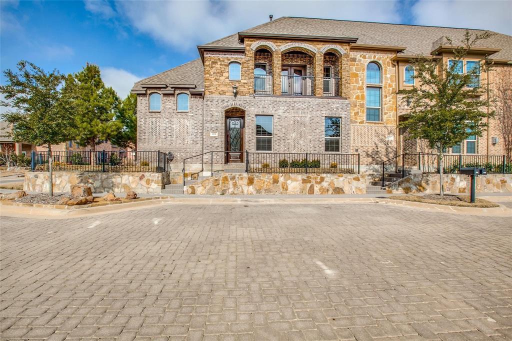 Gorgeous townhome in Keller Town Center, on a premium corner lot. Exclusive community with cobblestone streets and convenient access to Keller trail system. Outdoor cooking kitchen with natural gas grill, outdoor TV, gas log fireplace and plenty of space to entertain. Interior features soaring ceilings, custom built-ins, hand-scraped floors and plantation shutters on all windows. Kitchen is chef's dream with a gas cooktop, built in microwave and oven, beautiful cabinetry and spacious pantry. Both dedicated bedrooms and bathrooms are upstairs. Primary features a private balcony, large soaking tub, separate shower with custom sprayers, dual vanities, and walk-in closet with storage galore. The downstairs flex room can be either a third bedroom, formal dining, home office or study. This room has a secret access built-in to the bookcase, that opens up to a safe room and walk in closet. Attached 2 car garage with plenty of storage.