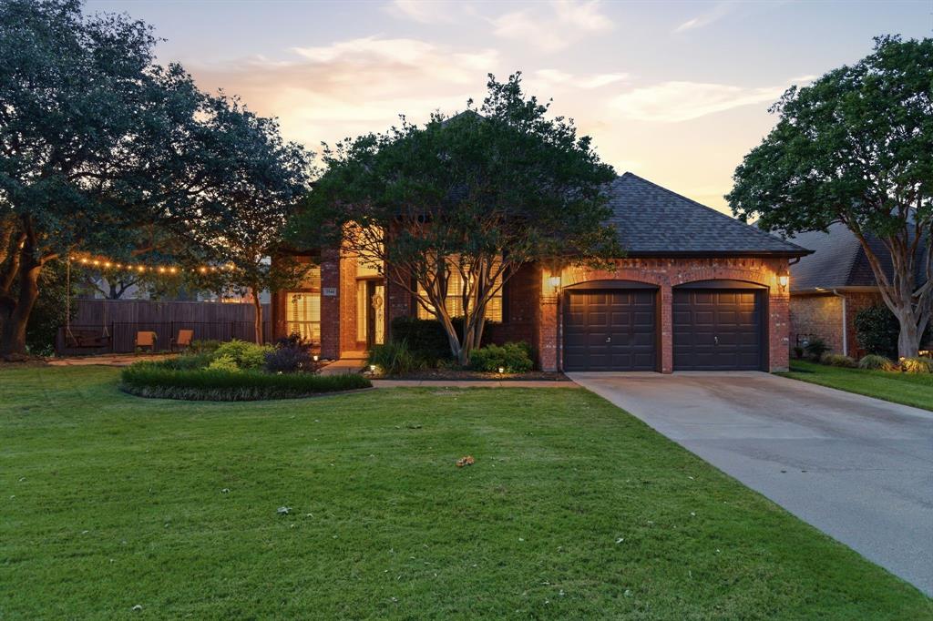 Welcome to this beautifully maintained home in the highly sought-after Carriage Glen neighborhood of Grapevine. Situated on approximately one-third of an acre and zoned to Grapevine-Colleyville ISD, this spacious 4-bedroom, 3.5-bath residence offers an exceptional combination of comfort, functionality, and outdoor living. The thoughtfully designed floor plan features a desirable first-floor primary suite, a dedicated office or flex space, formal dining room, and an inviting eat-in kitchen that flows seamlessly into the main living area. Elegant tile flooring adds timeless appeal, while fresh paint throughout the first floor creates a bright, updated feel. Plantation shutters throughout. The upstairs space includes a living space and three additional bedrooms, as well as two additional bathrooms. Step outside to your private backyard oasis. Designed for entertaining and relaxation, the expansive outdoor space includes a sparkling saltwater pool, hot tub, covered patio, and cozy fire pit area. The fully fenced yard provides ample room for play, pets, and gatherings, all within the privacy of your own retreat. Ideally located near Parr Park, walking trails, playgrounds, shopping, dining, and major commuter routes, this exceptional property offers the perfect balance of neighborhood charm and everyday convenience. Do not miss the opportunity to own this stunning Grapevine home with resort-style amenities, generous living spaces, and an unbeatable location. Information herein is deemed reliable. However, Buyer and Buyer's Agent should verify all information, including taxes, square footage, room sizes, schools, etc.
