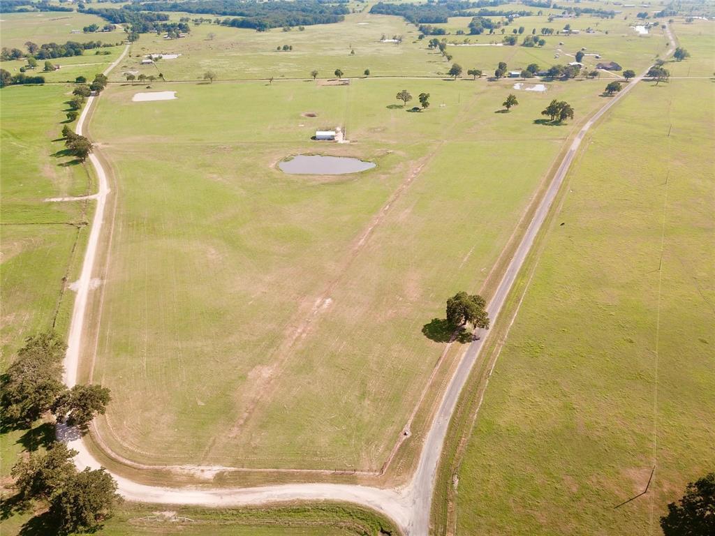 Tract 1 has almost 19 acres of pristine property with extensive road frontage. Very well maintained coastal Bermuda pasture land with a nice pond. Fenced on all sides. Great location to build your dream home. Restrictions apply. Tract 3 available for purchase.