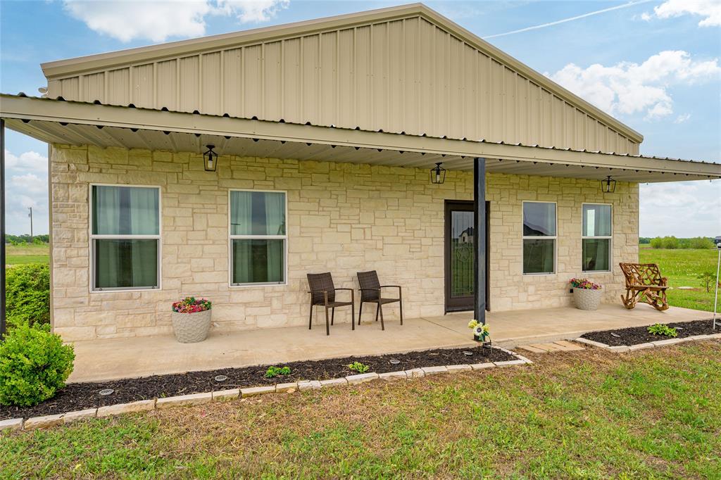 MOTIVATED Seller just lowered the price! There’s something special about finding a place where life can slow down just enough to enjoy it and this beautiful 14 acre property offers exactly that. Tucked into peaceful country surroundings, this move-in ready 3 bedroom, 2 bath barndominium blends comfort, practicality, and opportunity. Inside, you’ll find a thoughtfully designed space with granite countertops, a kitchen island perfect for gathering, and an easy, livable layout that feels like home from the moment you walk in. The insulated garage workshop adds incredible flexibility, ideal for projects, storage, or simply having the extra space so many buyers are searching for. There’s also a detached storage building and a generator hookup already in place, offering peace of mind and everyday convenience. 

What truly sets this property apart is the land. With 14 acres of ag-exempt ground, regularly maintained through mowing and hay baling, you have room to breathe, room to grow, and room to create something even more. Whether you’re looking for space to spread out or considering building an additional home for multi-generational living, the possibilities here are real and ready. The front porch faces west, delivering some of the most beautiful sunsets you’ll find quiet evenings, open skies, and that unmistakable feeling of being exactly where you’re meant to be.
And while it feels like a world away, you’re still conveniently located less than 3 miles to Leonard, with easy access to McKinney, Greenville, and Bonham.

Surrounded by growing development, including nearby high-end homes on large lots selling around $500K, this property stands out as a rare combination of value, land, and lifestyle. If you’ve been looking for a place that offers both simplicity and opportunity, this one is worth your time to see.

All information is deemed reliable but not guaranteed.  Realtor and buyer are responsible for verifying all information.