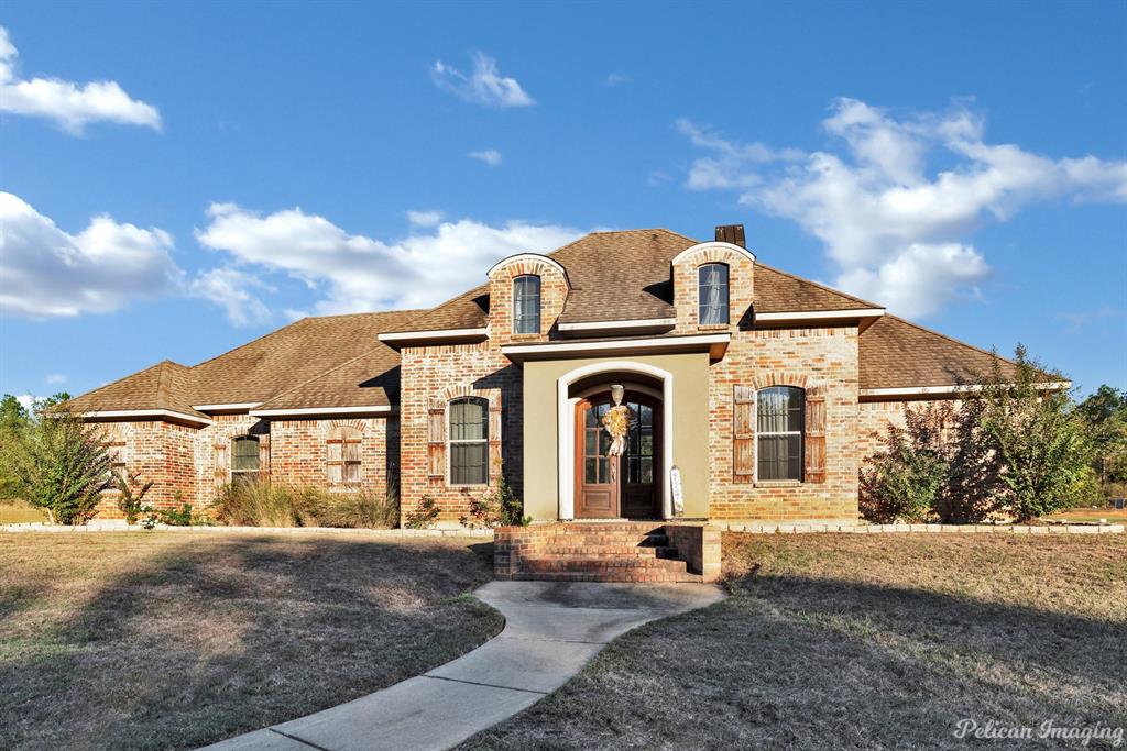 This beautiful home has four bedrooms and 3.5 bathrooms making it suitable for a family. This property is situated on a 2.96-acre lot, a significant amount of outdoor space, for the family to enjoy. The interior features a large open layout, which creates a sense of spaciousness and flexibility in how you use the living spaces. The kitchen is well-equipped with a substantial number of cabinets and storage, providing space for your cooking and storage needs. The kitchen also features stained concrete flooring and counter tops, giving this beautiful home a unique and modern look, it also includes stainless steel appliances. The master bedroom is remotely located in the house, offering privacy, impressive stall shower, and a whirlpool tub. Sellers are motivated and we will consider all reasonable offers.