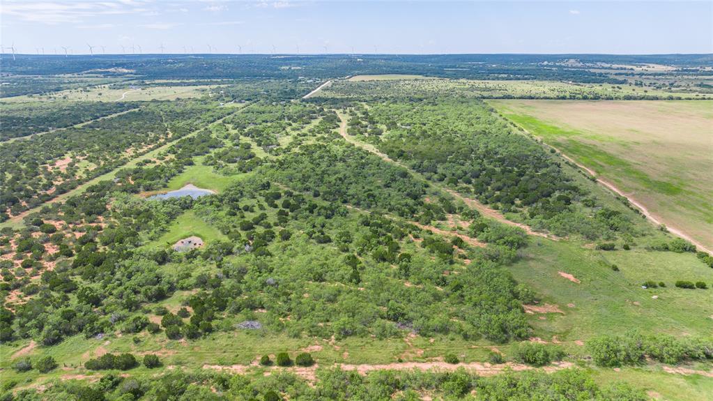 Just 30± minutes from Abilene, this 90± acre ranch is the ideal size for anyone looking to build a home, run a few head of cattle, or own a private hunting getaway in the highly desirable Jim Ned ISD.

A blend of native grasses, dense brush, and multiple stock tanks creates excellent habitat for whitetail deer, hogs, turkey, and other native wildlife while providing dependable grazing opportunities. Rural water is available through North Runnels County Water Supply, making this tract well-positioned for your future homesite or weekend cabin.

Whether you're looking for a place to raise a family, enjoy the outdoors, or invest in Texas land, this property offers the space, privacy, and versatility that's becoming harder to find. Wake up to wide-open views, spend your afternoons exploring the ranch, and enjoy the convenience of being just a short drive from Abilene.