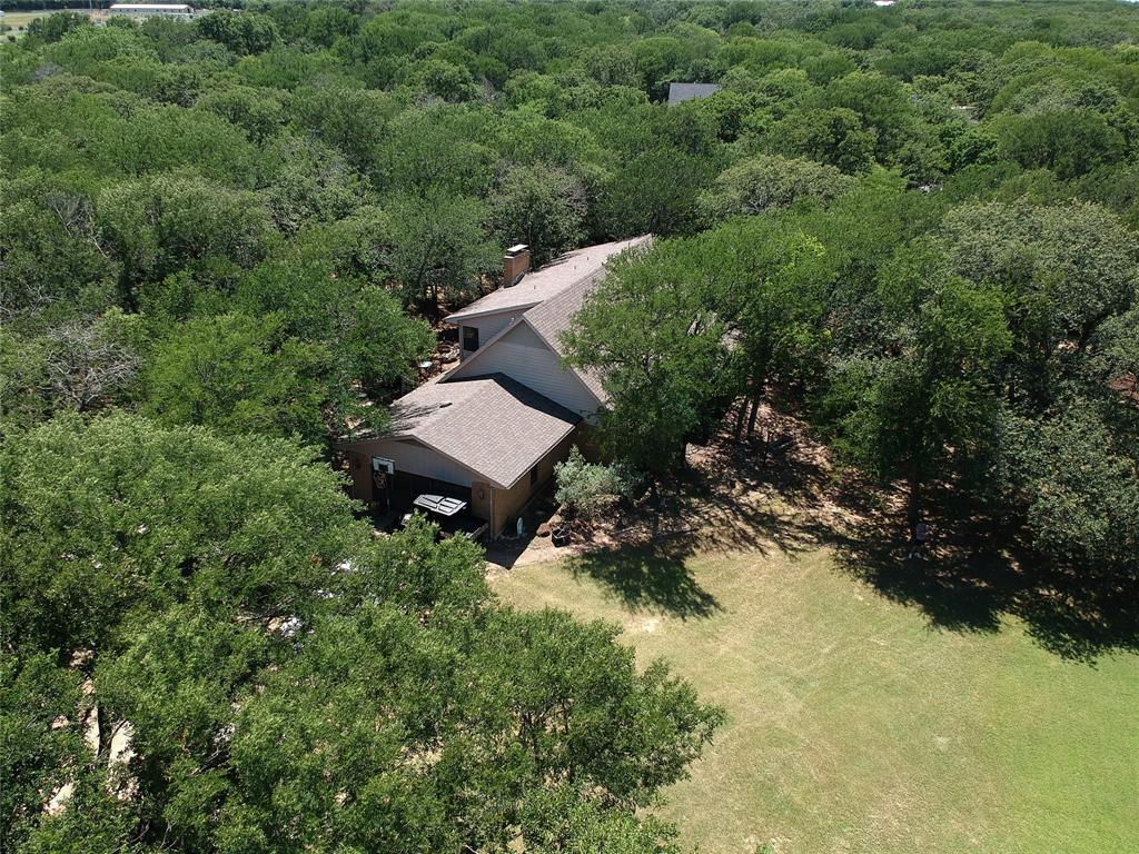 Welcome to your private equestrian paradise in the heart of Copper Canyon! Nestled beneath a stunning canopy of mature trees, this gated 2.5-acre estate offers the perfect blend of serene country living and exceptional convenience.

Step inside this spacious 5-bedroom, 3-bathroom home featuring both formal living and dining rooms, ideal for entertaining. The large kitchen is a chef's delight, offering ample space for culinary creations. Nearby, a large utility room delivers ultimate functionality with a sink, wrap-around cabinetry, and abundant counter space. The primary suite is a private retreat, tucked away with an ensuite bathroom with dual vanities. A desirable 5th bedroom is conveniently located on the first level, perfect for guests or a home office. No photos available of 5th bedroom due to privacy but you can see it during showing. Formal living and Formal dining are a perfect for entertaining guest. 3 spacious bedrooms on second level. 2nd level has a loft and large walk in attic. Bedroom 4 has no photos, but you can view bedroom 4 during showing

Outside, the fully gated acreage is a hobby farmer's dream, complete with a barn, stables, a workshop, and a chicken coop—fully prepared for your horses and chickens. Enjoy unmatched peace and privacy while being just minutes away from the premier shopping, dining, and entertainment of Highland Village..