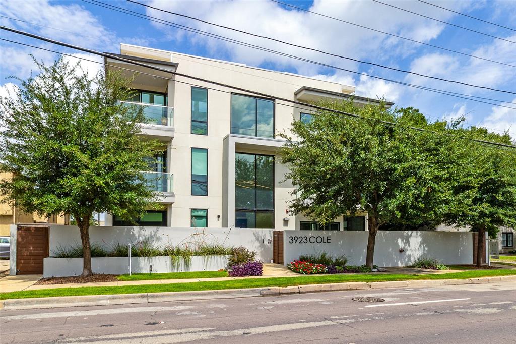 Experience refined, single-level living in this exceptional contemporary residence, privately positioned in the heart of Uptown's coveted West Village. Offering its own private entrance, this sophisticated condo seamlessly blends modern design with an unbeatable walkable location just steps from the Katy Trail, premier dining, boutique shopping, and vibrant entertainment.
Designed with both style and functionality in mind, the home showcases expansive storefront-style glass that fills the interior with natural light, custom Italian cabinetry, premium European flooring, smooth-finish walls, and elegant gas fireplaces. The gourmet kitchen is appointed with striking quartz and marble countertops, while the spa-inspired bathrooms feature luxurious marble tile finishes.
Residents enjoy the convenience of a private lobby, elevator access, a secured building with underground parking monitored by video surveillance, two assigned parking spaces, and a climate-controlled ground-level storage unit. Completing the home is a rare private outdoor retreat featuring a fenced yard and patio—an ideal extension of the living space for relaxing or entertaining.  Underground private garage units assigned are located at number 10 and 11. Private electric car charger installed at parking space 11.  Storage unit is available to tour upon request.