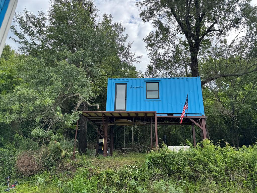 LOCATION, LOCATION, LOCATION!!! These tracts do not come up for sale often! A sportsman’s paradise of 5 acres on the private Long Lake. Property features deer, hogs, raccoons, and fishing galore. A bespoke spray-foam insulated cabin is perched over the lake. No known restrictions. Electric is on site. Buyer to handle water and sewer. The property is in a flood zone, although the property has held very little water throughout a very rainy spring and early summer. The address is 1312 A County Road 2123, Palestine, TX, which neighbors 1260 An CR 2123. Buyer to verify all information.