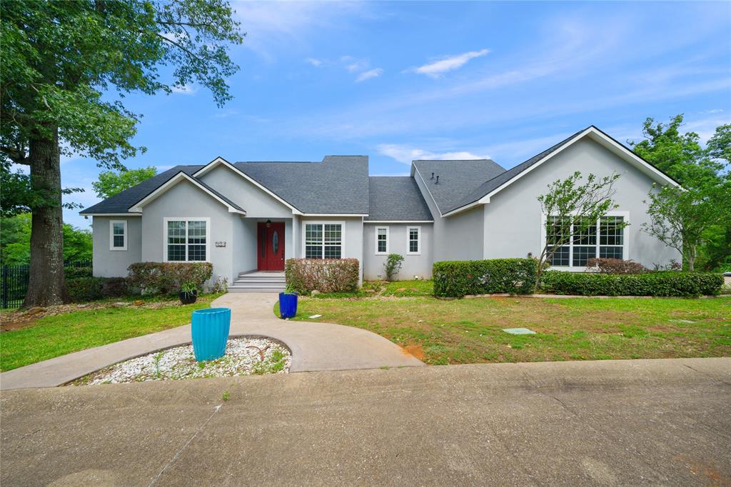 Nestled inside the gated Ridge Creek Place community, this 4 bedroom, 2.5 bath home with a 2 car garage sits high above South Tyler and delivers big views and even bigger lifestyle. Perfectly located just minutes from shopping, dining, and everything you need, you get the best of both worlds, privacy, space, and convenience, all on a rare 2.27 acres inside the city. The elevated setting is what really sets this property apart. The back patio and balcony take full advantage of the ridgeline, creating sweeping hilltop views over Hollytree Golf Course, and on the 4th of July, you’ve got front row seats to fireworks without ever leaving home. The backyard is built for living and entertaining. A recently added swimming pool anchors the space, with plenty of room left over for kids, pets, gardens, or future plans. It’s the kind of outdoor setup that feels like a private retreat while still being minutes from town. Inside, the home is bright, open, and thoughtfully laid out. The upgraded kitchen features granite countertops, quality appliances, a large island, and a breakfast bar, ideal for everyday living or hosting a crowd. The formal living and dining areas are flooded with natural light and framed by those incredible views, making them just as inviting as they are impressive. A bonus room adds flexibility as a home office, playroom, or media space. The primary suite sits privately at the back of the home, offering beautiful scenery, a spacious bath, and a generous walk in closet. The additional bedrooms are well sized with high ceilings, keeping everything light and airy throughout. Practical touches matter too, the laundry room is conveniently located between the main living space and the extended three car garage, making daily life just a little easier. Acreage, gated privacy, elevated views, a pool, and a prime South Tyler location, this is one of those properties that doesn’t come around often, schedule your showing today!