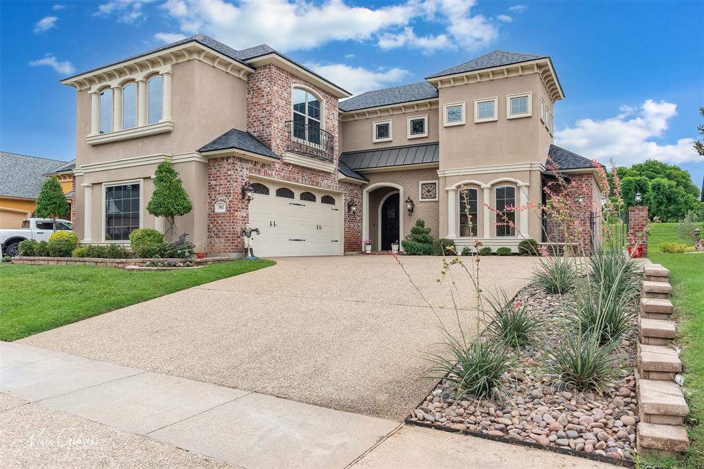 Step into a true custom masterpiece where timeless craftsmanship meets thoughtful functionality. This stunning 4 bedroom 3.5 bath home offers 2,845 sqft of beautifully designed living space, filled with extensive moldings, intricate details, and elevated finishes that are anything but builder grade. 3 bedrooms are downstairs along with 2.5 baths. Master suite is remote and attached to a stunning master bathroom complete with a massive walk in closet. Upstairs is an oversized bedroom featuring a full bathroom, bar area, and extra closet or storage space. This room could also serve as an office or fantastic media room. The open concept living room and chefs kitchen are ideal for entertaining family and guests. Kitchen offers extensive seating around the large island along with an attached breakfast area. The mirrors and light fixtures throughout add the personal touch of style and every room reflects quality and character. Outside offers a large covered brick patio that opens seamlessly to the homes interior for perfect indoor, outdoor entertaining. With its curated design and undeniable charm, this home feels like living in a jewel box! Rare, refined, and absolutely unforgettable.