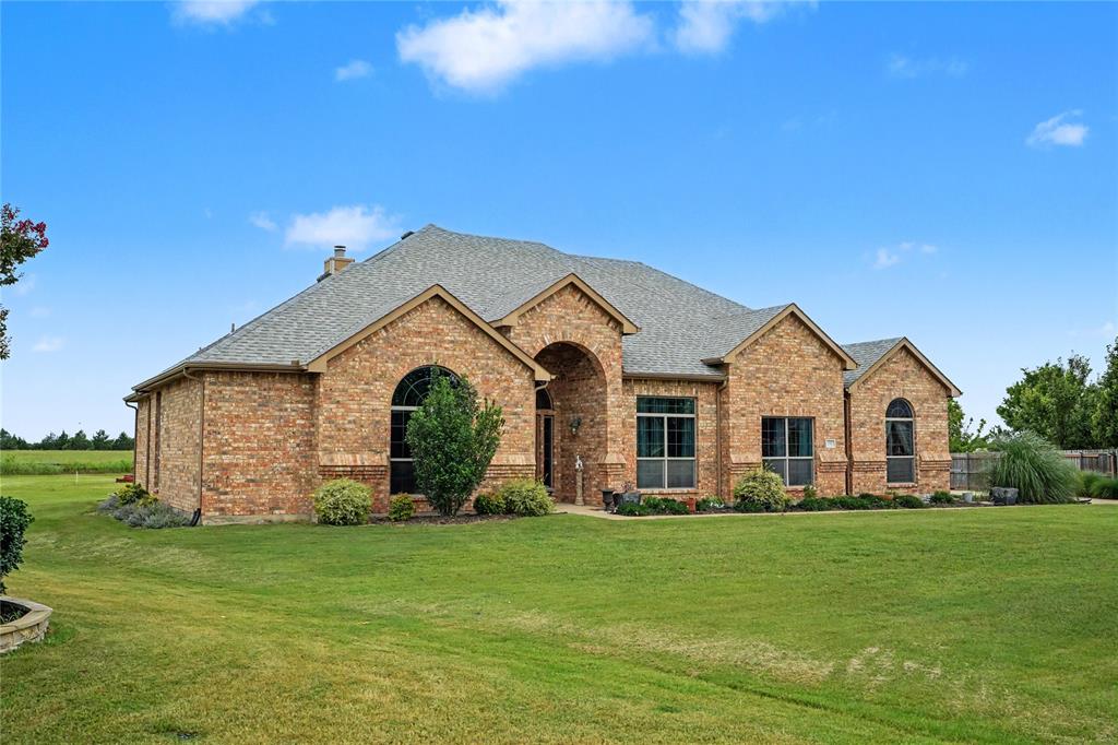 Welcome to your private Texas retreat on nearly an acre in the desirable Northeast Meadows community. This beautifully maintained 4-bedroom, 2-bath home offers approximately 2,686 square feet of thoughtfully designed living space, blending comfort, functionality, and outdoor enjoyment.  Step inside to an open-concept floor plan featuring elegant wood flooring, abundant natural light, a cozy fireplace, and a chef-inspired kitchen complete with a 7-foot island, double ovens, gas cooktop, and ample cabinetry perfect for entertaining family and friends.  The spacious primary suite is a true retreat, featuring a spa-like bath, oversized walk-in closet, and direct access to the extended screened-in back patio. Enjoy year-round outdoor living from the covered and screened porch overlooking the expansive backyard. Unwind in the relaxing jacuzzi-hot tub and take in the peaceful country setting.  A standout feature of this property is the approximately 36' x 24' workshop-shop with electricity, ideal for hobbyists, woodworkers, mechanics, or additional storage. The shop includes power and workspace flexibility while complementing the home's oversized parking and garage options. The property also offers a three-car garage plus additional covered parking.