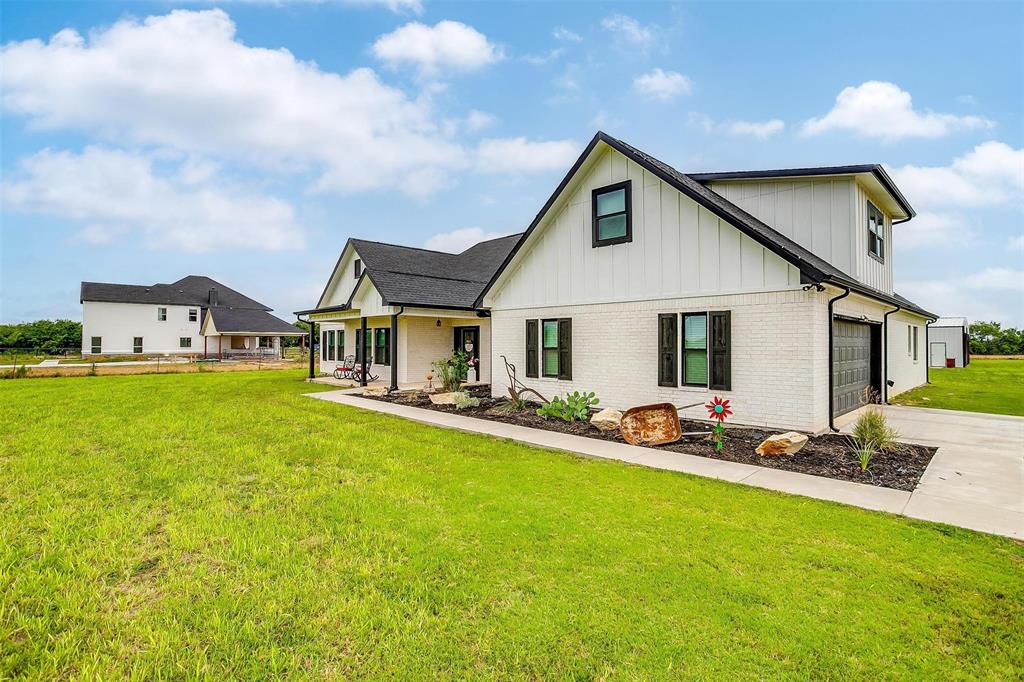 2+ACRES, GODLEY ISD, NO HOA, NO WATER BILL, 3 BAY DOOR SHOP, MINUTES FROM THE TOLLWAY, 4 BEDROOMS PLUS BONUS ROOM, BUILT IN 2022
Discover this exceptional custom-built retreat nestled on 2+ acres in the sought-after Godley ISD. Designed with modern elegance and everyday convenience, this nearly 3,000 sq. ft. home offers 4 spacious bedrooms, 3 full baths, and a flexible upstairs bonus room perfect as a 5th bedroom, private office, or guest suite with its own bath.
The heart of the home features a seamless flow between the living, kitchen, and dining areas. Enjoy a cozy tumbled stone electric fireplace, granite countertops, a generous walk-in pantry, and a welcoming eat-at bar ideal for entertaining.
 Unwind in a light-filled primary suite with a spa-inspired ensuite bath—complete with a soaking tub, oversized walk-in shower with dual showerheads, double vanities, and a spacious walk-in closet.
 The split-bedroom design ensures privacy for all, while dual AC units and water heaters keep the home efficient and comfortable. Use all the water you want because there is NO water bill! Outside, a recently constructed 40x40 shop on concrete with three bay doors offers endless possibilities for storage, hobbies, or business needs.
 Located in the highly rated Godley ISD with no HOA restrictions, this property offers both freedom and educational excellence.
 Schedule your private tour today and experience for yourself all the space and style this home has to offer.