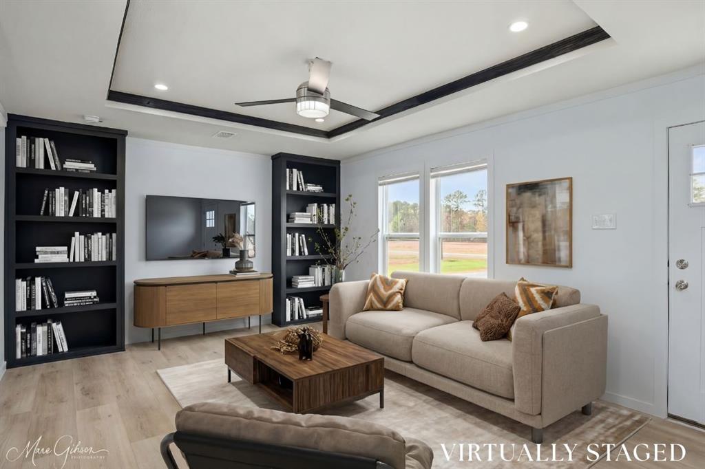 This brand new 3-bedroom, 2-bath home sits on a spacious ½-acre lot in a quiet neighborhood in the Haughton School District. Featuring modern finishes throughout and custom-style built-ins in the living room, this home offers both function and charm. Included in the sale are a covered back porch, front  and side door steps, gravel driveway, and skirting — all complete and ready for move-in. Located just steps away from the neighborhood fishing pond, this property offers affordable living with a small-town feel and plenty of space to enjoy life outdoors. Stylish. Comfortable. Move-in ready. An excellent option for those wanting affordable housing without sacrificing quality or character.