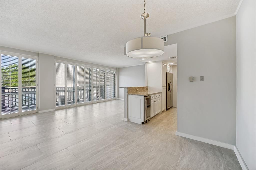 Welcome to this nicely updated, quiet 3rd-floor end unit offers plenty of natural light and custom plantation shutters throughout! Living-dining areas have floor-to-ceiling windows that open to a 32’ terrace constructed of long-lasting Trex Select decking (replaced by the building HOA in April ‘23). Open galley kitchen features a breakfast bar, granite countertops, tile backsplash and SS appliances including a wine fridge. Other highlights include decorative lighting, closet systems and wood floors in living-dining areas, hallway & kitchen. Condo has been freshly painted and is move-in ready. Monthly HOA dues cover all utilities & hi-speed internet service. Preston Tower amenities include 24-7 front desk & valet office attendants, assigned basement parking, fitness center, laundry facility, club room w kitchen, library, tennis court, dog park and garden pool area w fire pit. Desirable Preston Hollow location w easy access to Preston Center, NorthPark and Preston Royal shops & restaurants.