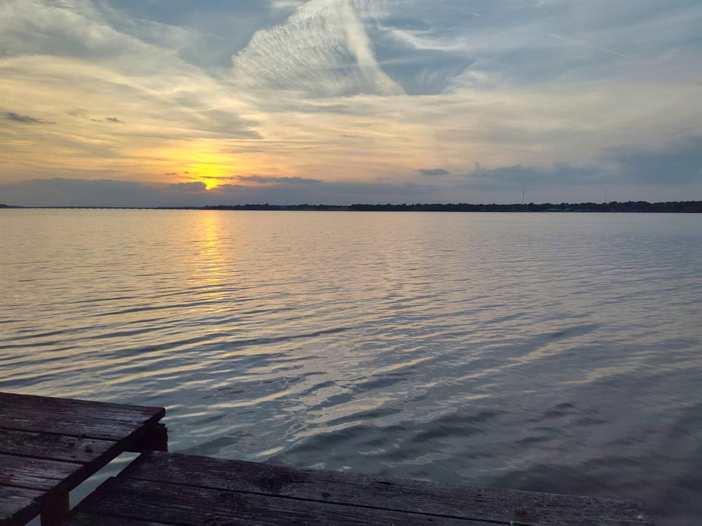 Experience the most incredible sunsets from this open water lakefront lot on Cedar Creek Lake! Gently sloping to the waters edge, full of mature trees and ready to build the lake house of your imagination all in an unincorporated location. Previous residence was removed and the boat house remains for your immediate enjoyment. Easy access to Gun Barrel City and Hwy 175. One hour to Downtown Dallas.