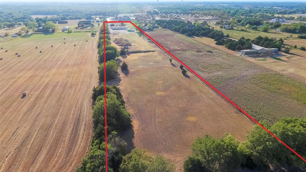 Prime development opportunity near Melissa High School! This parcel is currently occupied by a 3 bedroom 2 bathroom brick home with city water and  septic. It also includes a large building behind. Subdivisions are being developed all around this lot!  This lot could be developed now or held for future use.  Commercial zoning in front and Ag exempt in back.
Property next door is also available if you want a larger piece (MLS#20640775)