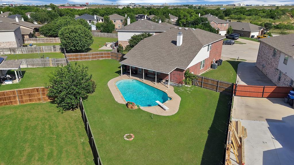 GREAT OPPORTUNITY FOR INVESTOR! Leased through February 2027. Tenant occupied. Welcome to 5317 Riverflat Court, a well maintained  two-story home in the highly sought-after Eagle Mountain-Saginaw ISD. Located on a quiet col-de-sac adjacent to a pond and greenbelt. This home is flooded with natural light, offering a Primary Suite downstairs and 3 Additional Bedrooms upstairs. At 3,000 square feet, the open living space upon entry is ideal for a home office, formal dining or a playroom-study area for the kids. The open-concept layout is ideal for both everyday living and entertaining. The spacious living room is anchored by a brick fireplace with views into the backyard. The kitchen is designed with functionality in mind, featuring ample cabinet space, a large pantry, and generous prep areas leading into a breakfast room off the kitchen. The second floor boasts an oversized game room space with an office nook, three large bedroom and an additional full bath. Step outside to your private pool and covered extended patio perfect for Texas summers! Built in 2005 and located in an established neighborhood, this home offers convenient access to shopping, dining, and major highways. Move-in ready and thoughtfully updated, perfect as a primary residence or rental property.