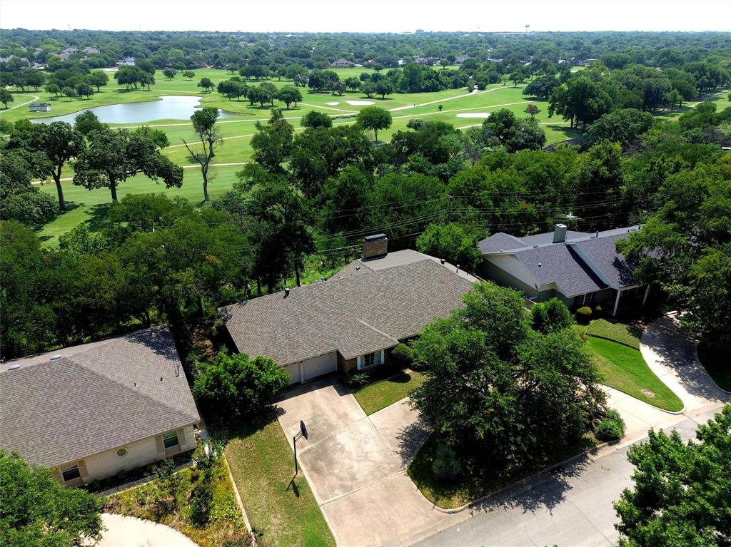 WELCOME TO 5920 DIAMOND OAKS DRIVE (S), HALTOM CITY, TX  76117*FABULOUS VIEWS OF DIAMOND OAKS COUNTRY CLUB GOLF COURSE & BIG FOSSIL CREEK*CREEK LOT, SITUATED HIGH ON A HILL WITH FABULOUS PANORAMIC VIEWS*PROPERTY ACTUALLY BACKS TO THE GOLF COURSE AND GROUNDS! NO HOA*ROOF INSTALLED 6 YEARS AGO*OPEN FLOOR PLAN*PRIMARY ENSUITE IS LOCATED ON 2ND LEVEL WITH FIREPLACE AND BALCONY*HAVE BREAKFAST ON THE BALCONY & TAKE IN THE LOVELY VISTAS! 2 FIREPLACES-ONE IN LIVING, ONE IN PRIMARY ENSUITE*NATURAL GAS AVAILABLE FOR FURNACE, WATER HEATER*2 LIVING*2 DINING*3 BEDROOMS*2.5 BATHS*2 CAR GARAGE WITH CIRCLE DRIVE*INTERIOR LOT*MATURE MAJESTIC TREES*GROVE OF TREES PROVIDE SHADE*BRICK CONSTRUCTION*COMPOSITION ROOF*NATURAL NATIVE LANDSCAPING*BACK PATIO MEASURES 23 X 17, WITH STEPS DOWN TO THE CREEK*LVP FLOORING THROUGHOUT MUCH OF HOME* CARPET IN THE BEDROOMS*ONE STAIR SYSTEM*KITCHEN IS EQUIPPED WITH STAINLESS APPLIANCES, ELECTRIC RANGE, DISHWASHER, MICROWAVE AND PANTRY*GRANITE COUNTERS ARE FEATURED AT THE BREAKFAST BAR WHICH PROVIDES ADDITIONAL SEATING FOR YOUR GUESTS*FORMAL LIVING*FORMAL DINING*HALF BATH HAS GRANITE COUNTERS AND WHITE CABINETRY*GRANITE COUNTERS ARE ALSO IN THE UTILITY ROOM A SINGLE SINK AND ROOM FOR A FREEZER*THE FIREPLACE IS THE FOCAL POINT OF THE LIVING ROOM AND IS OPEN TO THE KITCHEN AND BREAKFAST AREA*THE SECONDARY BEDROOMS ARE LOCATED ON THE FIRST LEVEL*THE LARGE BEDROOM ON THE FIRST FLOOR COULD BE CONSIDERED A PRIMARY BEDROOM, AS WELL*THERE IS A 2 CAR FRONT ENTRY GARAGE*SELLER PLANS TO LEAVE PATIO FURNITURE, FILE CABINET, GARAGE SHELVING & PORTABLE AC UNIT ON 2ND LEVEL AT NO COST TO BUYER*FRIDGE WASHER & DRYER WILL CONVEY ALSO WITH ACCEPTABLE OFFER*PLEASE SEE NTREIS FOR 360 TOUR, HIGH DEFINITION PHOTOS, FLOOR PLANS, AMENITIES & FEATURES LIST AND SELLERS DISCLOSURE*YOU MAY DISCOVER YOU CAN’T LIVE WITHOUT IT!