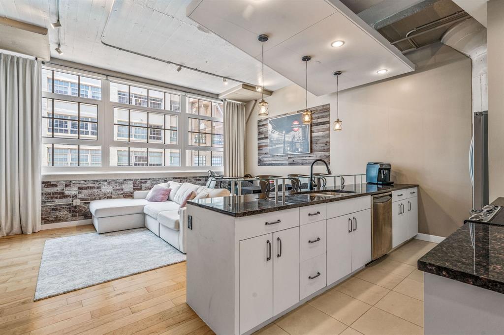 Welcome to luxury living in the heart of Fort Worth! This beautifully appointed condo offers an unbeatable location near the Cultural District, Dickies Arena, Will Rogers Coliseum, Fort Worth Zoo, and the Botanic Gardens—plus countless shops and dining options just moments away. Inside, you’ll find a smartly designed floor plan that begins with a private guest bedroom featuring its own ensuite bath—perfect for visitors or a home office. The stylish kitchen features stainless steel appliances, sleek built-in cabinetry, and ample counter space, along with a convenient built-in desk area for productivity at home. The open-concept living area is ideal for entertaining or relaxing, with electronically controlled window treatments for ultimate comfort and ease. The spacious primary suite is a true retreat, complete with a spa-inspired ensuite bath, dual sinks, walk-in shower, and generous closet space. Montgomery Plaza residents enjoy access to world-class amenities including a rooftop pool and spa, outdoor kitchen and grill areas, cabanas, putting green, corn hole, media room, indoor lounge, first-class fitness center, gated dog walk, and 24-hour concierge and security. Don’t miss this rare opportunity to own a piece of Fort Worth luxury—schedule your showing today!