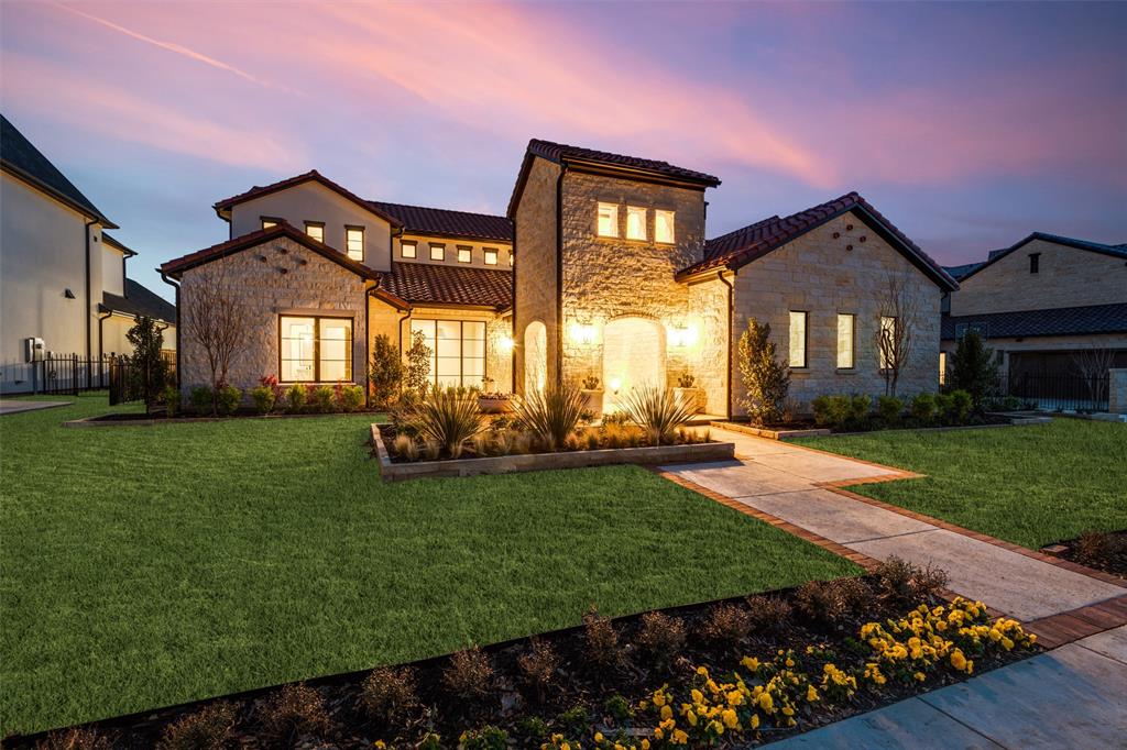 Ron Davis Custom Homes stunning 2 Story Modern Tuscan Home w. Stone & Stucco, front private entrance courtyard w. fire place, viewable from dining room for elegant privacy in DFW’s hottest neighborhood: exclusive Homestead almost sold out section of Newman Village. Close access to Dallas North Tollway, Frisco ISD & minutes from PGA golf. Covered entry to custom made Iron & Glass Door to experience a level of elegant, refined luxury  defining all Ron Davis Custom Homes. Open Concept Tuscan w. Gourmet Kitchen, Professional appliances  and view of outdoor living & family living areas is built for entertaining. The impressive entryway looks towards the Dining Room with Temperature Controlled Artistic Wine Display & Butler’s Pantry. Covered Outdoor Living with full Outdoor Kitchen and Two Sided Fireplace, TV & Sound wiring. Mud Cubbies, two staircases, Rani Tankless Water heaters, Comfort Built Energy Construction science, Lutron + more!