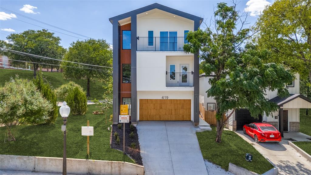 Luxury Living in Dallas! Nestled in the sought-after Bottoms District, this stunning three-story home offers 4 bedrooms, 2 full baths, 2 half baths, plus a flexible bonus room that can easily serve as a 4th bedroom, home office, or entertainment space. The open-concept design features a chef's kitchen with quartz countertops, an oversized island, pot filler, built-in natural stone dining area, and a cozy fireplace. The luxurious primary suite boasts a spa-inspired bath with a freestanding soaking tub. The third floor is designed for entertaining with a theater room, wet bar, and private balcony, while additional front-facing balconies on the second and third floors complete this exceptional home. A perfect blend of sophistication, comfort, and modern luxury in one of Dallas' most desirable neighborhoods.