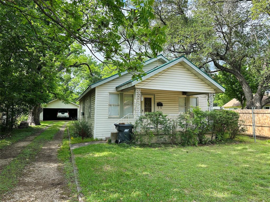 Charming 2-bedroom, 1-bath home in the heart of Corsicana ISD! Nestled on a spacious 0.344-acre lot, this home offers a partially fenced backyard, ideal for pets or outdoor enjoyment. The detached 2-car garage adds excellent storage or workspace potential. With plenty of character and room to grow, this home is a fantastic starter opportunity—just bring your vision and a little TLC to make it your own! Located just minutes from downtown, schools, churches, parks, shopping, and dining, you'll love the convenience and charm of this neighborhood.