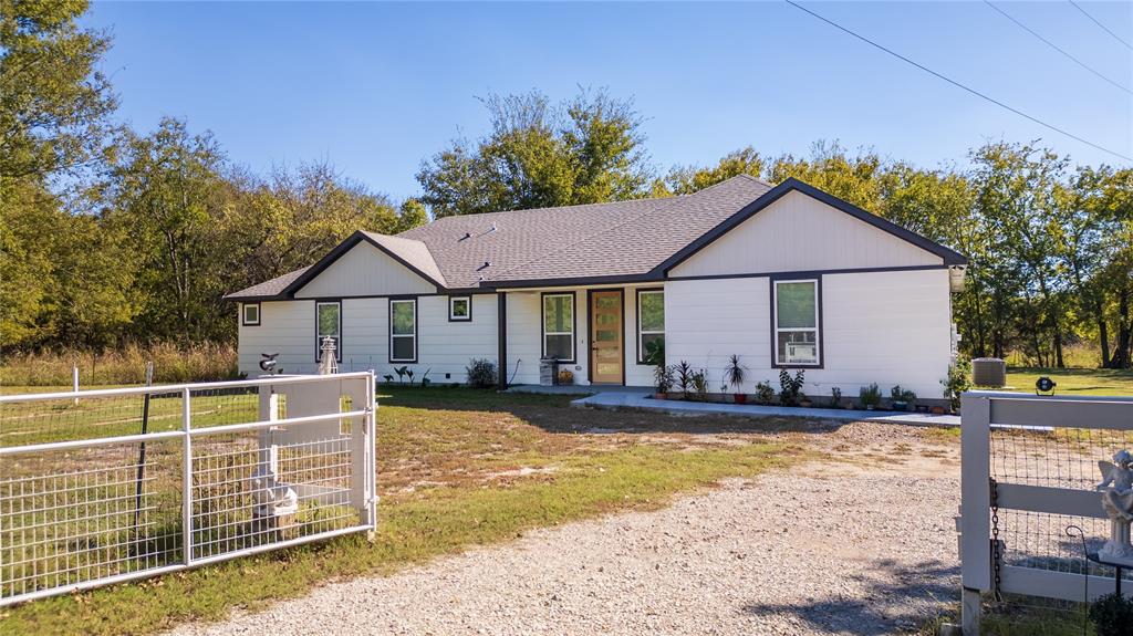 Welcome to 811 VZ County Road 3810 in Wills Point, TX, a stunning 2024-built home offering 4 bedrooms, 3½ baths, and 1,993 square feet of thoughtfully designed living space. The open-concept layout features a bright, spacious living area that flows seamlessly into a modern kitchen with stylish finishes, perfect for entertaining or everyday living.The primary suite offers a private retreat with a luxurious ensuite bath, while a secondary primary suite ideal as a mother-in-law suite includes its own private bathroom, providing comfort and flexibility for multigenerational living or guests. Two additional bedrooms and baths complete the well-designed floor plan. Outside, the property includes three separate sheds. One is currently being converted into a gym space and is partially finished out with plumbing in place for a bathroom, offering incredible potential for a home gym, studio, or guest quarters. The other two sheds provide ample storage space for tools, equipment, or recreational items. Enjoy peaceful country living with modern finishes and room to grow, all while remaining conveniently located near Wills Point amenities. This move-in-ready home blends comfort, versatility, and contemporary style, ready to fit your lifestyle.