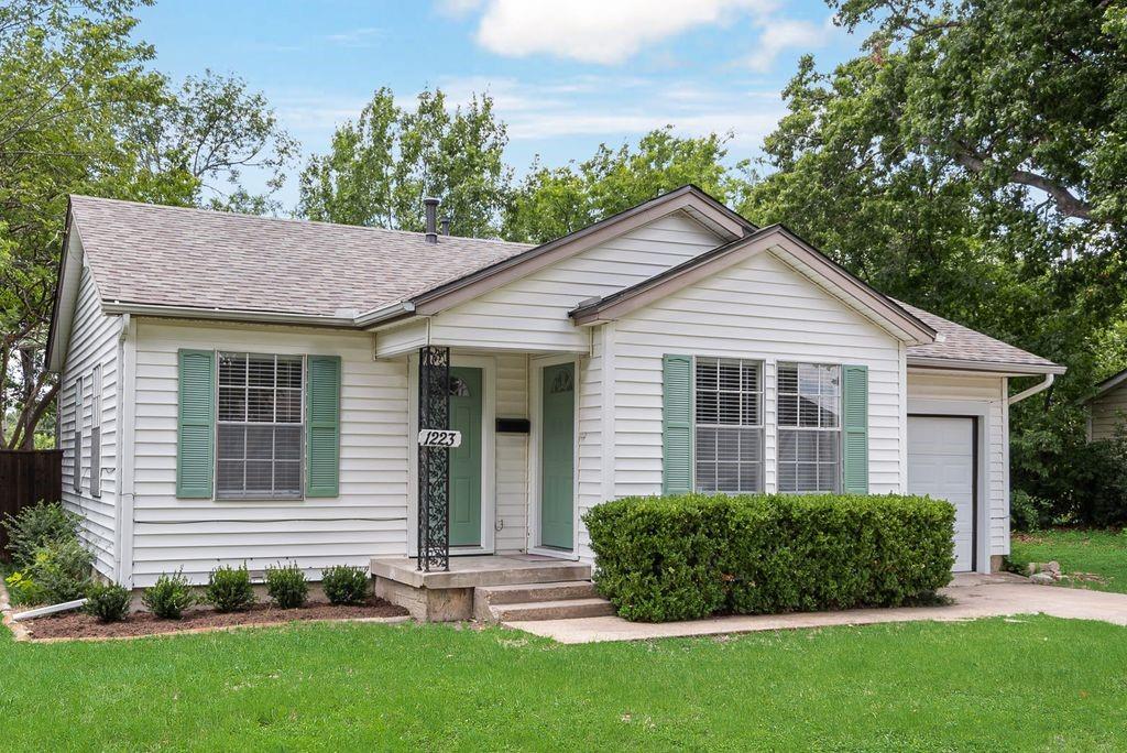 Charming and move-in ready, this 2 bedroom, 1 bath craftsman sits on a quiet East Dallas street just minutes from White Rock Lake, the Dallas Arboretum, and the shops and restaurants at Casa Linda Plaza. Classic curb appeal greets you with sage green shutters, a covered front porch, and mature shade trees. Inside, the original hardwood floors have been beautifully refinished, flowing seamlessly from the light-filled living room into an open-concept kitchen. The kitchen has been fully updated with quartz countertops, painted cabinetry, a stainless steel appliance package. The breakfast bar keeps the space connected for entertaining. Both bedrooms are generously sized with abundant natural light, and the remodeled bathroom features a subway-tiled tub-shower and quartz vanity. A bonus mudroom off the kitchen and garage adds everyday storage and connects to the fenced backyard. The backyard is spacious, shaded by mature trees, and includes a storage shed. With plenty of room to make your own for gardening, entertaining, or relaxing. A one-car garage and long driveway complete the package. This home is ready and waiting for its next owner.