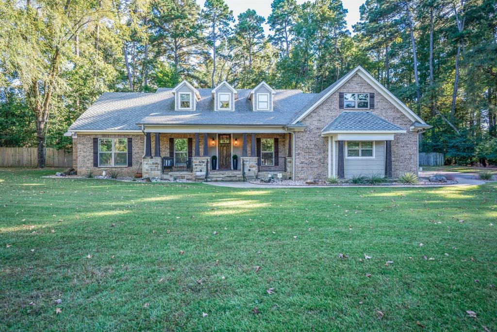 Some homes check boxes. This one changes how you live.

Welcome to 491 Hall Dr—set on 1.686 acres in award-winning Hallsville ISD, ideally positioned between Longview and Hallsville with quick Hwy 80 access. From the moment you arrive at the front porch, it’s clear this home was designed with a level of intention you do nott often find, with flagstone accents, cedar touches, cable railings, and a rich wood ceiling setting the tone.

Step inside and you will feel it immediately:  space, light, and purpose. Soaring ceilings, a flexible front room that adapts to your lifestyle, and an open living area anchored by a striking stacked-marble fireplace and expansive backyard views.

The kitchen was designed for the way people actually live - gathering, hosting, and moving effortlessly through the space with elevated amenities featuring a massive island with hidden storage, granite countertops, walk-in pantry, coffee bar, “Sonic-style” ice maker, and premium appliances including double convection ovens and a pull-out microwave drawer.

The primary suite feels like a private retreat ... a place to unwind and reset ... with dual custom closets and a spa-like bath featuring a soaking tub beneath a barrel-vaulted wood ceiling, a spacious tiled shower and dual vanities.

Upstairs offers a large media or game room and additional flex space, while the covered back porch invites you to slow down with flagstone flooring, a stained ceiling, hot tub hookup, and built-in holiday lighting.

A rare standout is the detached private flex space, ideal for a private office, client-facing workspace, or creative studio that is separate when you need focus, connected when you don’t.

Outside city limits with no HOA, this property offers something increasingly hard to find: freedom, flexibility, and a home that was built to live differently.

This isn’t a one-size-fits-all home - and that’s exactly the point. Schedule your showing today.