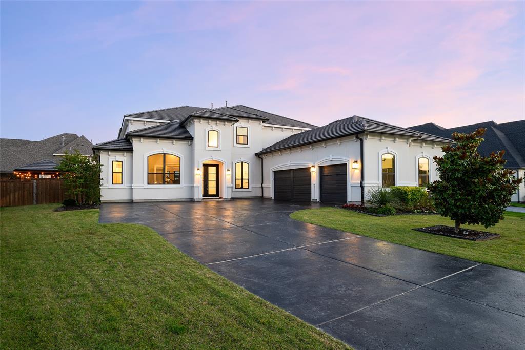 Welcome to Normandy Circle, an extraordinary Toll Brothers residence in Prosper’s prestigious Star Trail community. Offering 4,442 square feet of impeccably designed living space, this 5 bedroom, 4.1 bath home blends luxurious finishes and resort-style outdoor living. A grand foyer with a sweeping staircase creates an unforgettable first impression, flanked by an elegant dining room and an executive study featuring custom built ins. The living room showcases soaring ceilings, striking fireplace, custom built ins, and walls of windows that flood the home with natural light. The gourmet kitchen is designed to impress, featuring professional grade appliances, built in refrigerator, extended custom cabinetry, stunning quartz countertops, large waterfall island with breakfast bar seating, wine cooler, and a spacious breakfast area overlooking the backyard. Tucked away on the main level, the luxurious primary retreat offers a sitting area and a spa-inspired bath complete with a soaking tub, oversized walk in shower with body sprays and rain shower, separate vanities, and an expansive custom closet system with direct access to the laundry room. A well designed mudroom and utility area add everyday convenience and functionality. Four generously sized secondary bedrooms each offer walk-in closets, while the spacious game room provides additional living and entertaining space. The dedicated media room with tiered flooring creates the ultimate cinematic experience for movie nights and game days. The backyard is a private resort with an expansive covered outdoor living area featuring a built in grill and refrigerator, all overlooking the heated pool and spa. A custom putting green completes the outdoor experience. Residents of Star Trail enjoy one of North Texas’ most amenity rich lifestyles with a clubhouse, resort style pools, tennis and pickleball courts, fitness center, parks, playgrounds, and miles of scenic walking and biking trails woven throughout the community.