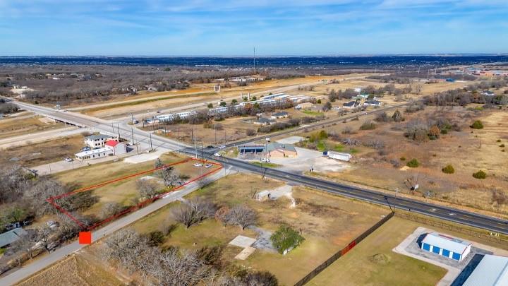 This parcel of land has septic, electricity, and a Water Meter. The property has a total of .97 Acres. There is road frontage on FM 917 and frontage on County Road 1022.   This property is in a Growth Area of Burleson and Joshua with easy access to the Chisholm Trail Parkway and approximately two miles from State Highway 174. The property has been annexed by the City of Burleson, and it is in the Chisholm Trail Corridor. This property is close to the master planned communities, Tallgrass and Chisholm Summit, that are currently under development.