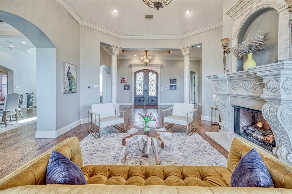 Incredible opportunity to own this magnificent 16 acre private gated estate in Arlington. A masterpiece of luxury, this beautiful Mediterranean style home features 3 levels, 5 bedrooms, 7 baths, 2 living rooms, 2 dining rooms, 4 fireplaces, 2 utility room and elevator. The west wing features the primary suite with sitting area and FP, dramatic ceiling and lighting, entrance to the veranda, 2 massive closets, coffee bar with refrigerator and a stunning Hollywood Bathroom. The Office has a FP, custom files and shelving. Stunning Kitchen with massive island, breakfast bar, builtin refrigerator and freezer, double gas ovens and cooktop and a huge walk-in pantry. Veranda with FP overlooking greenbelt and Rush Creek. Game room with separate Kitchen. Report style indoor heated pool with hot tub, water fall and slide. Cinematic Theater. 3rd floor has 4 bonus rooms.  4 car garage. BARN. ARENA. 5 fenced paddocks. Guest House. 2 Pavilions. Tack House. Additional 3.0 acres available for sale.