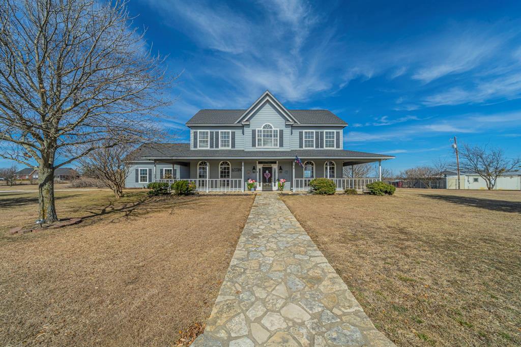 This gorgeous and meticulously maintained 2,630-square-foot farmhouse is ready for its next owner. Custom built in 2000 by the current owners and lovingly cared for by the same family ever since, this home reflects pride of ownership in every detail. Situated on 6 beautiful acres in highly sought-after Godley ISD, the property offers both privacy and a welcoming atmosphere with established neighbors. The grounds are thoughtfully improved and include a greenhouse, chicken coop, and a 1,500sf workshop and barn with concrete floors and built-in workbenches, providing exceptional versatility for hobbies, storage, or business use. Inside the barn, you’ll find a beautifully finished approximately 450sf man cave, offering incredible flexibility. This space features a large tiled bathroom with shower and a dry sauna, making it ideal as a guest suite, mother-in-law quarters, private retreat, or potential income-producing space, When including the approximately 450sf of finished man cave space, the property offers a combined total of approximately 3,080 square feet of usable living area, 2,630sf in the main residence plus 450 square feet in the finished barn space. Square footage is approximate and should be independently verified by buyer. With its blend of farmhouse charm, functional outbuildings, flexible bonus space, and acreage in a desirable school district, this property offers far more than a typical country home — it delivers lifestyle, versatility, and long-term value.